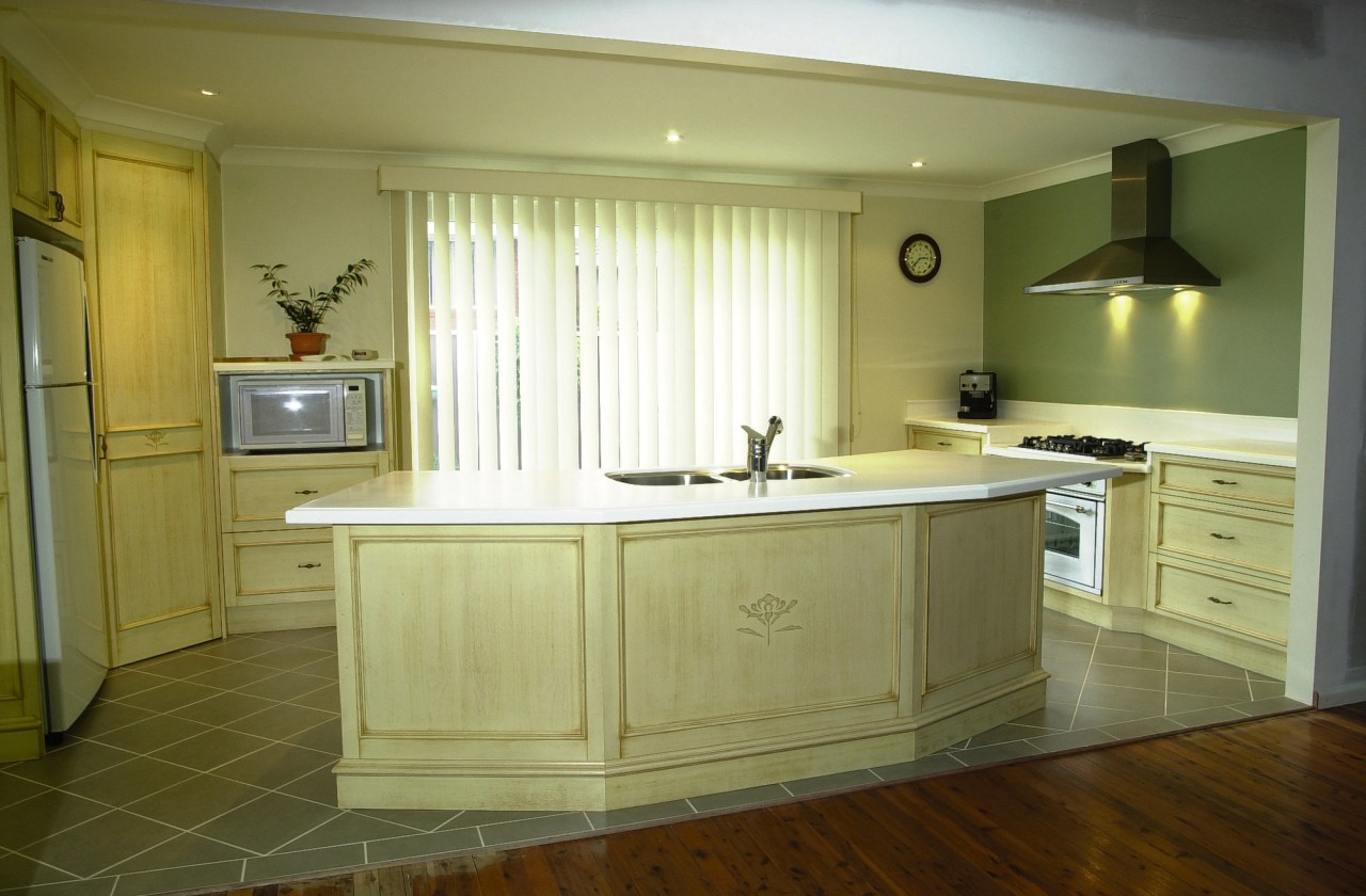 view of kitchen showing custom cabints, tiled flooring cabinetry, countertop, cuisine classique, floor, flooring, furniture, hardwood, interior design, kitchen, room, under cabinet lighting, wood flooring, brown