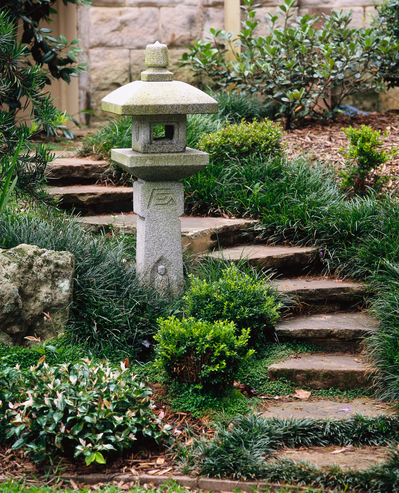 View of a Japanese Oribe lantern made of courtyard, garden, grass, landscape, landscaping, outdoor structure, plant, walkway, yard, green