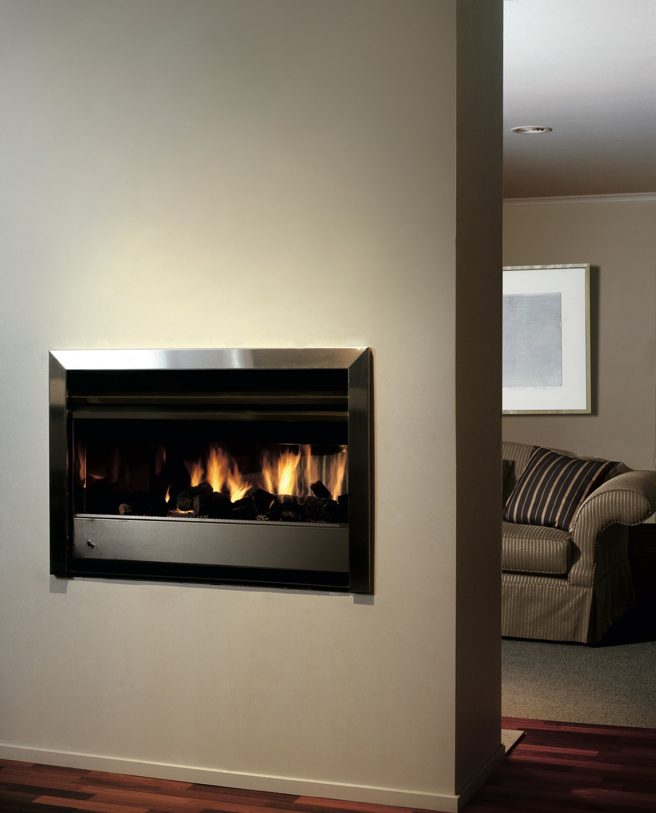 view of the fireplace situated in the walling fireplace, hearth, heat, home appliance, wood burning stove, gray, black