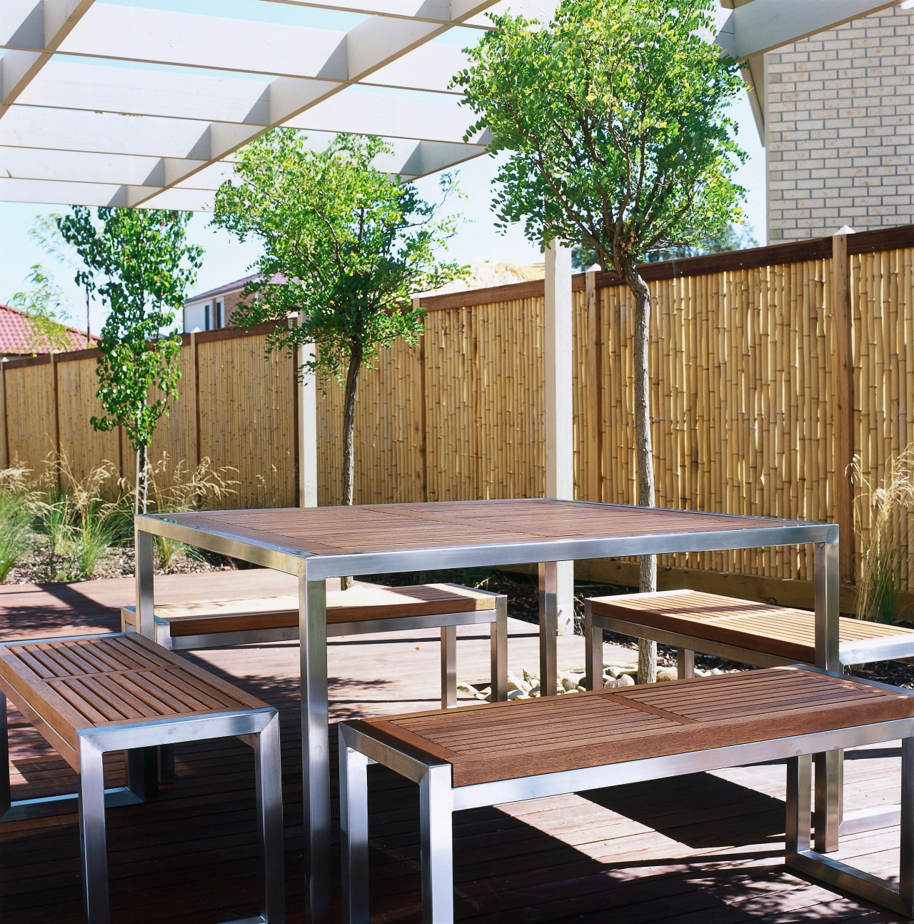 view of the contemporary indoor/outdoor furniture with stainless backyard, chair, deck, furniture, outdoor furniture, outdoor structure, patio, table, wood