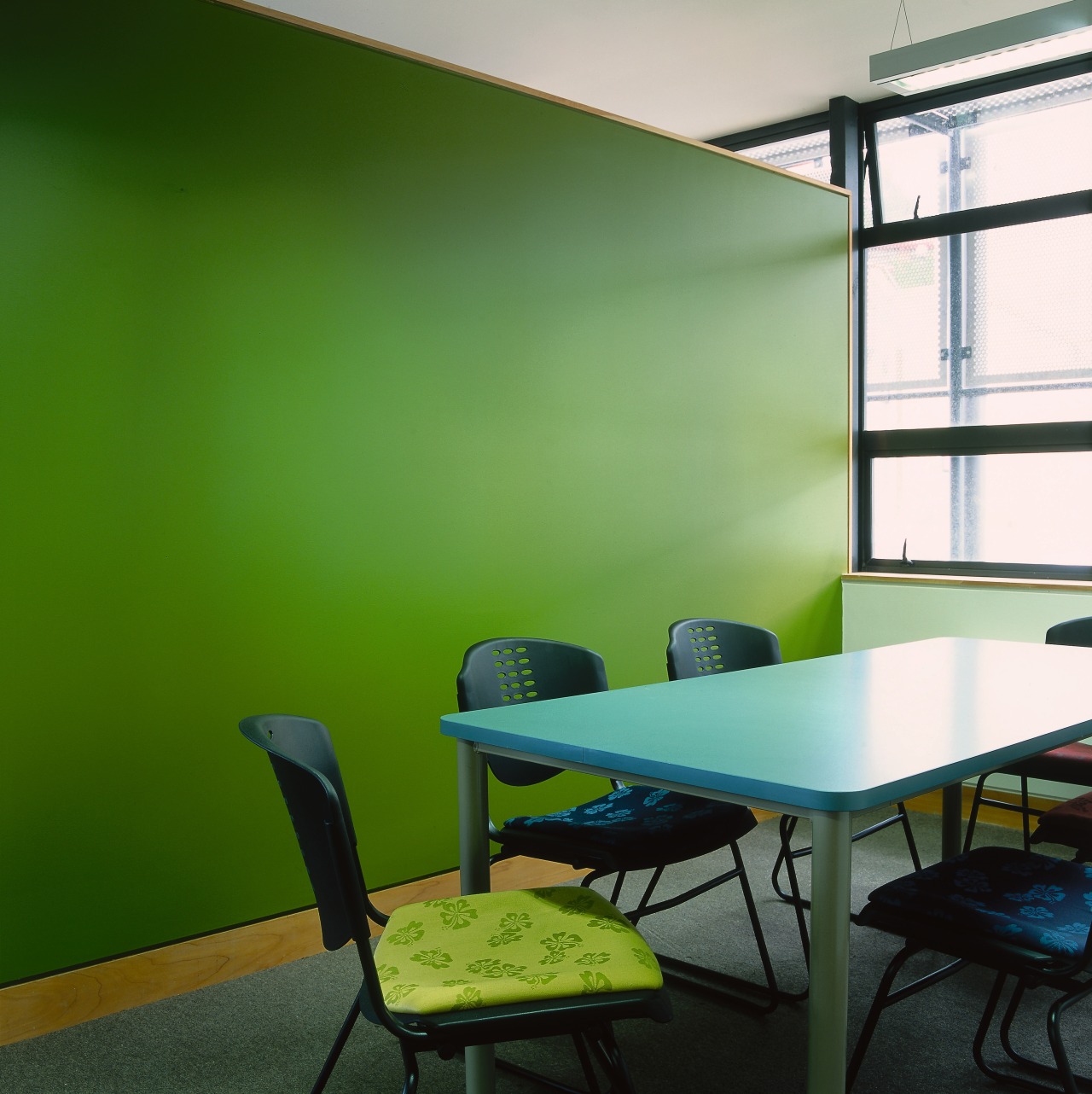 Meeting room with green feature wall, table and architecture, chair, furniture, green, interior design, office, product design, table, green