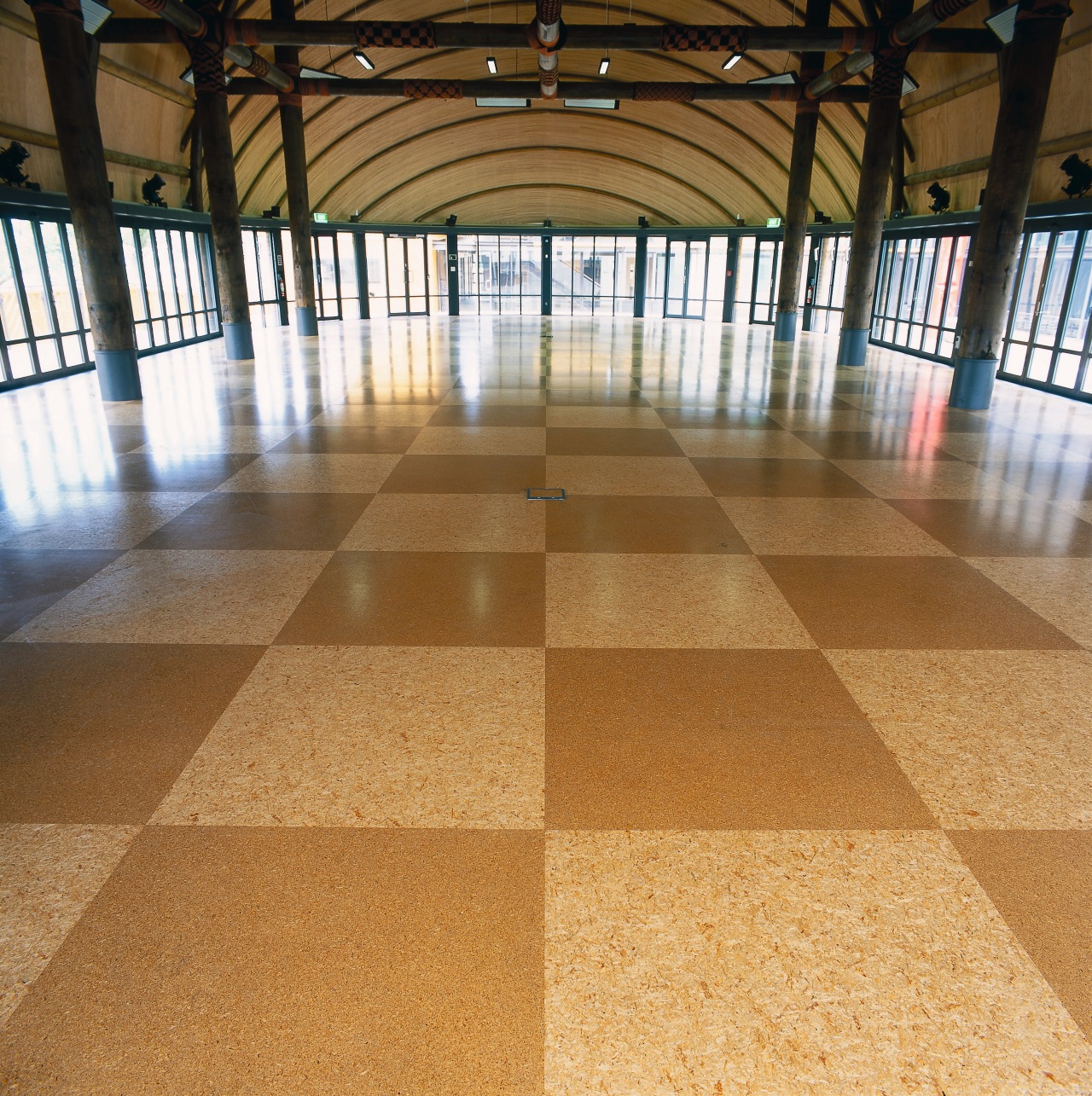 Building with expansive square patterned floor panels, columns daylighting, floor, flooring, hardwood, structure, wood, wood flooring, brown, orange