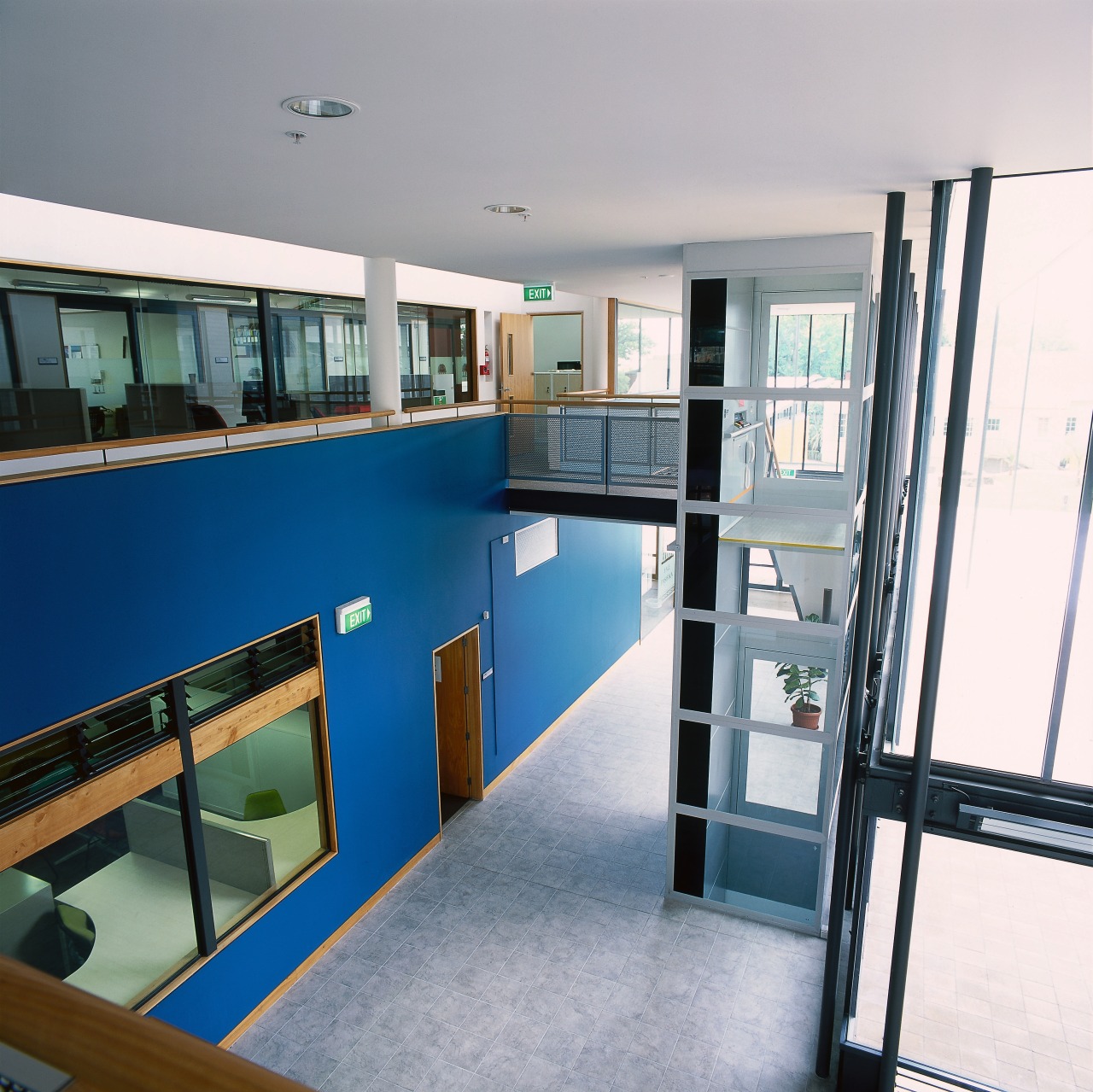 View of lobby area and glazed lift shaft. architecture, glass, handrail, real estate, gray