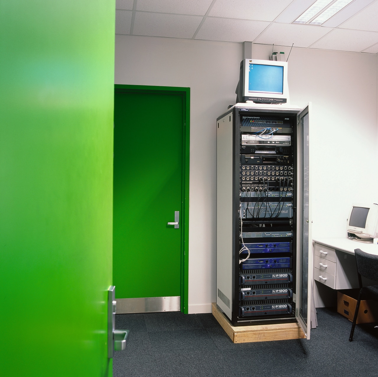 View of central computer unit for sound system. electronic device, product, technology, green, gray