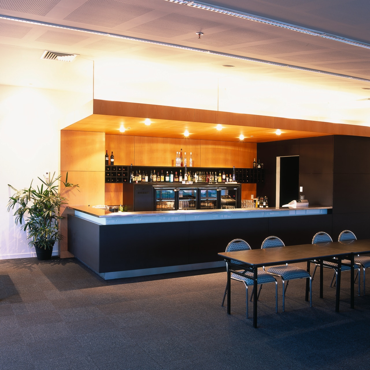 View of hospitality area in building with table furniture, interior design, lobby, table, black