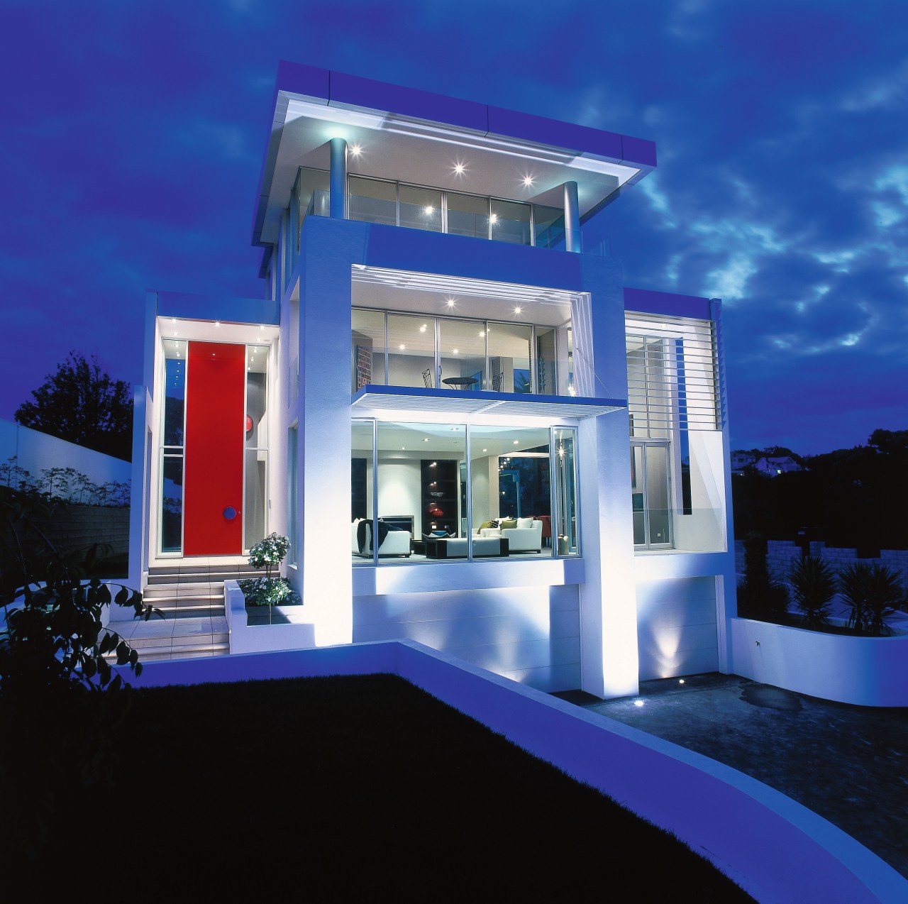 view of the house showing a red double architecture, elevation, estate, facade, home, house, interior design, lighting, majorelle blue, property, real estate, sky, villa, blue