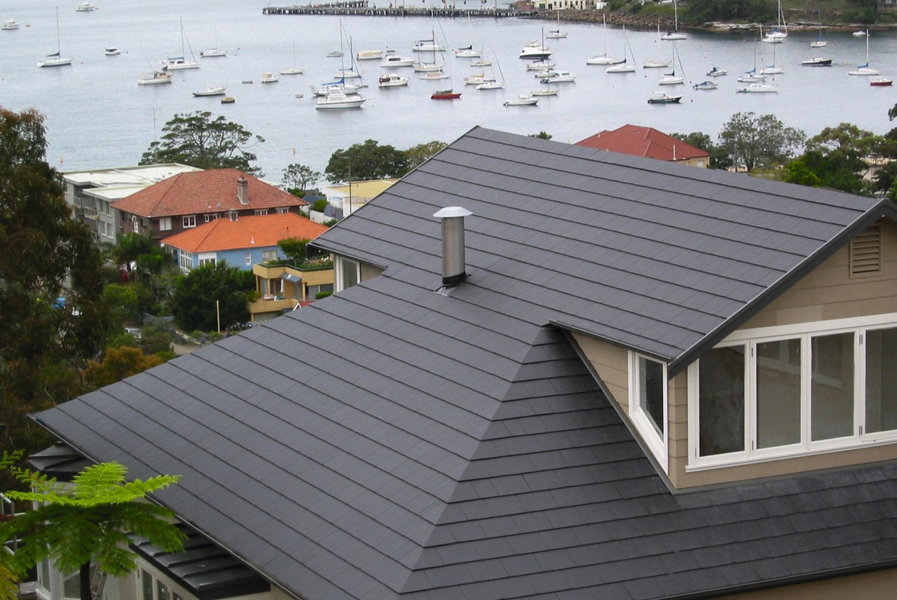 View of roof of house featuring grey roof daylighting, facade, home, house, outdoor structure, real estate, residential area, roof, siding, gray