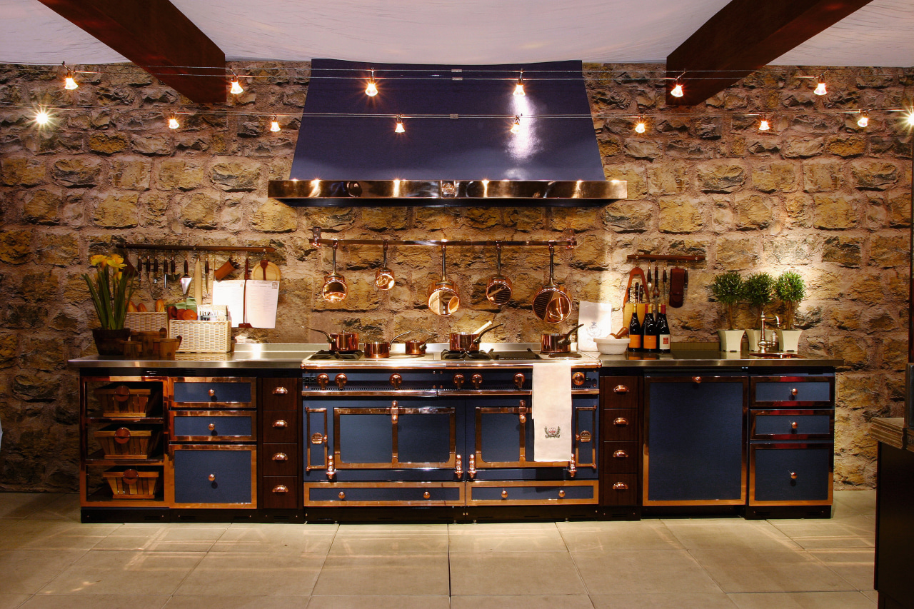 View of a kitchen with a feature wall cabinetry, countertop, cuisine classique, flooring, interior design, kitchen, brown