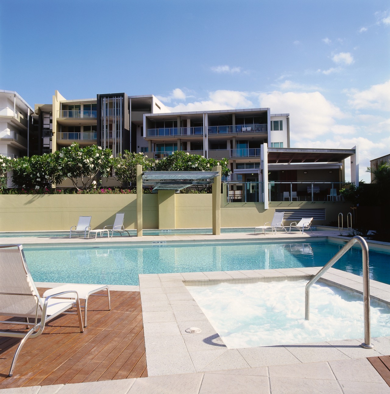 view of the recreation pool area apartment, condominium, estate, home, hotel, house, property, real estate, residential area, resort, swimming pool, villa, white