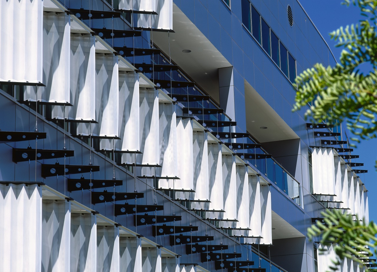 view of the exterior cladding architecture, brutalist architecture, building, commercial building, condominium, corporate headquarters, daytime, facade, headquarters, metropolitan area, mixed use, residential area, sky, structure, blue