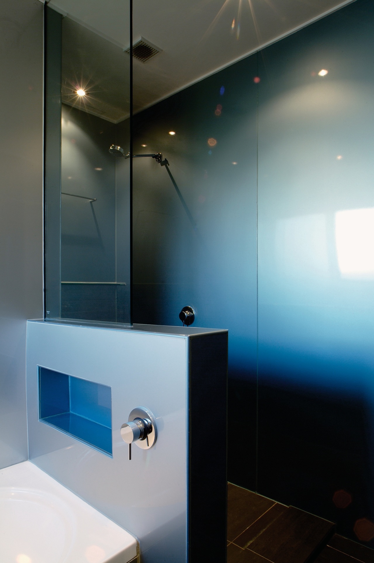 view of the shower wing wall showing recessed architecture, bathroom, ceiling, glass, interior design, light, light fixture, lighting, product design, room, sink, black, gray