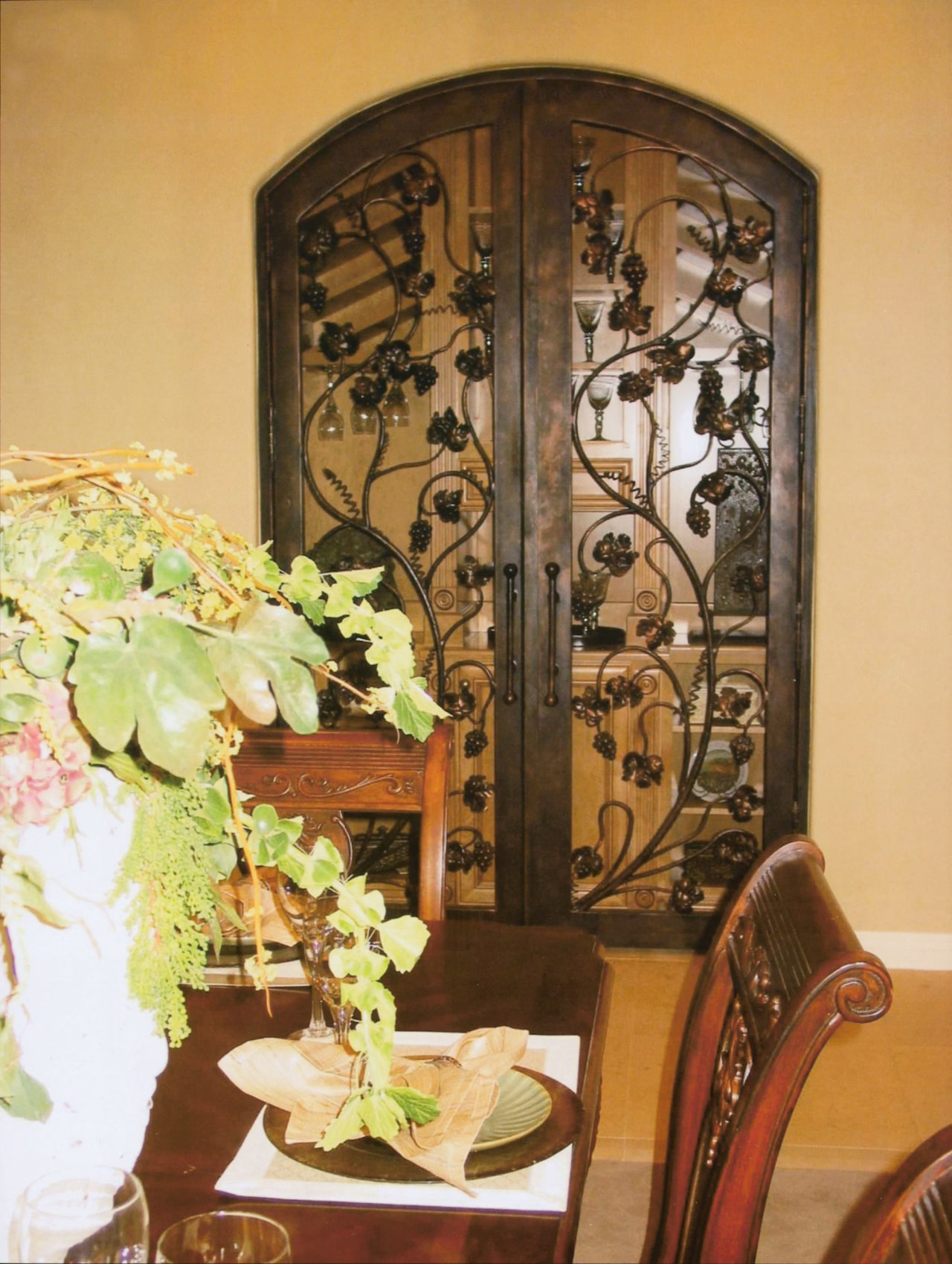 View of a large copper doorway with very dining room, floristry, flower, flower arranging, furniture, interior design, table, brown, orange