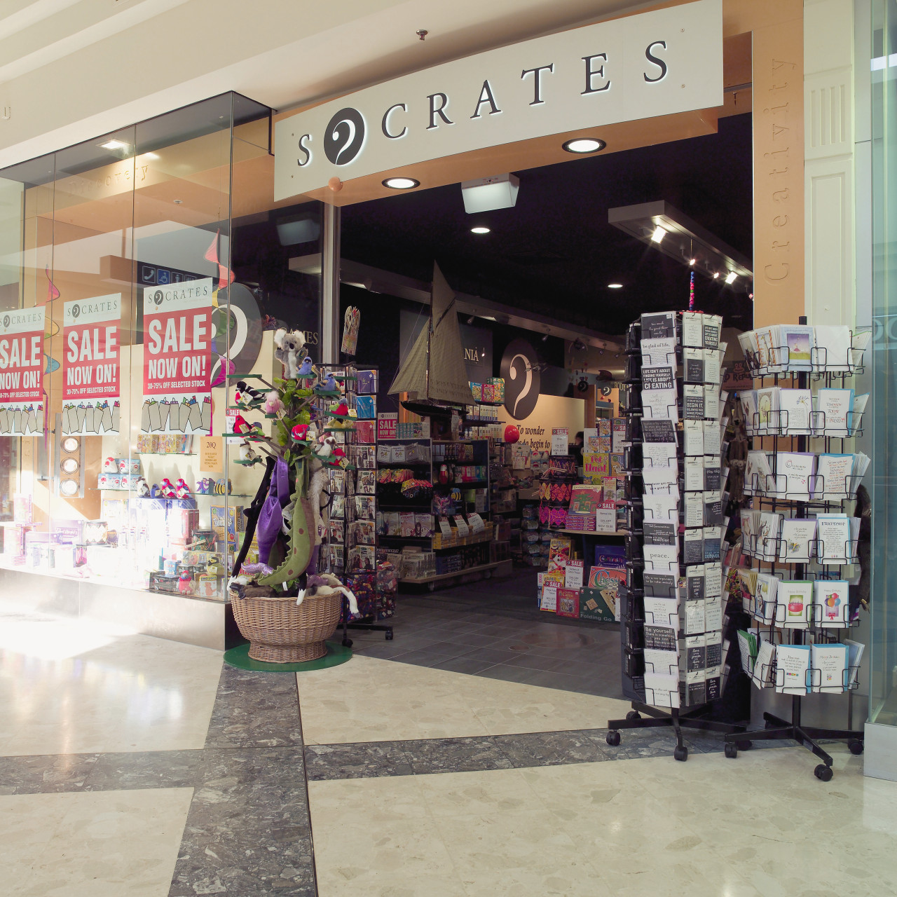 Exterior of Socrates gift store. convenience store, outlet store, product, retail, shopping mall, supermarket, gray