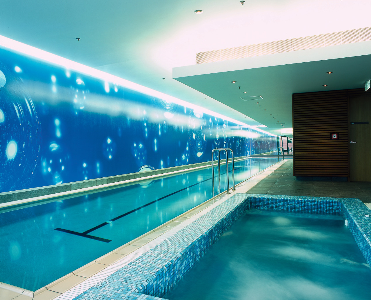 Indoor swimming lap pool and spa pool. interior design, leisure, leisure centre, lighting, reflection, swimming pool, water, teal