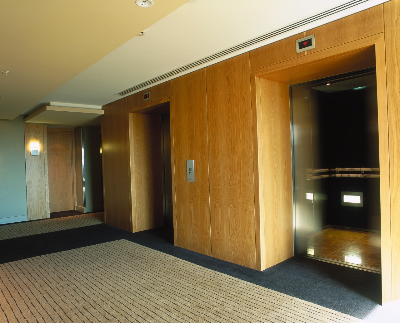 Lobby area with veneered wall panels. ceiling, door, floor, flooring, hardwood, interior design, laminate flooring, property, real estate, room, wall, wood, wood flooring, brown