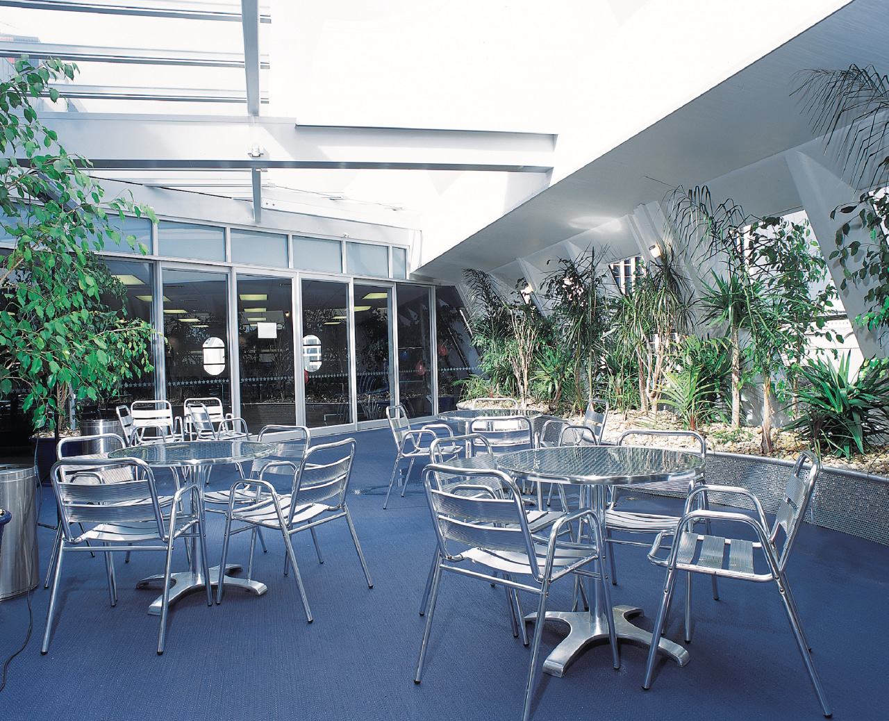 exterior of Student common room at Crown Institute architecture, plant, table, blue, white