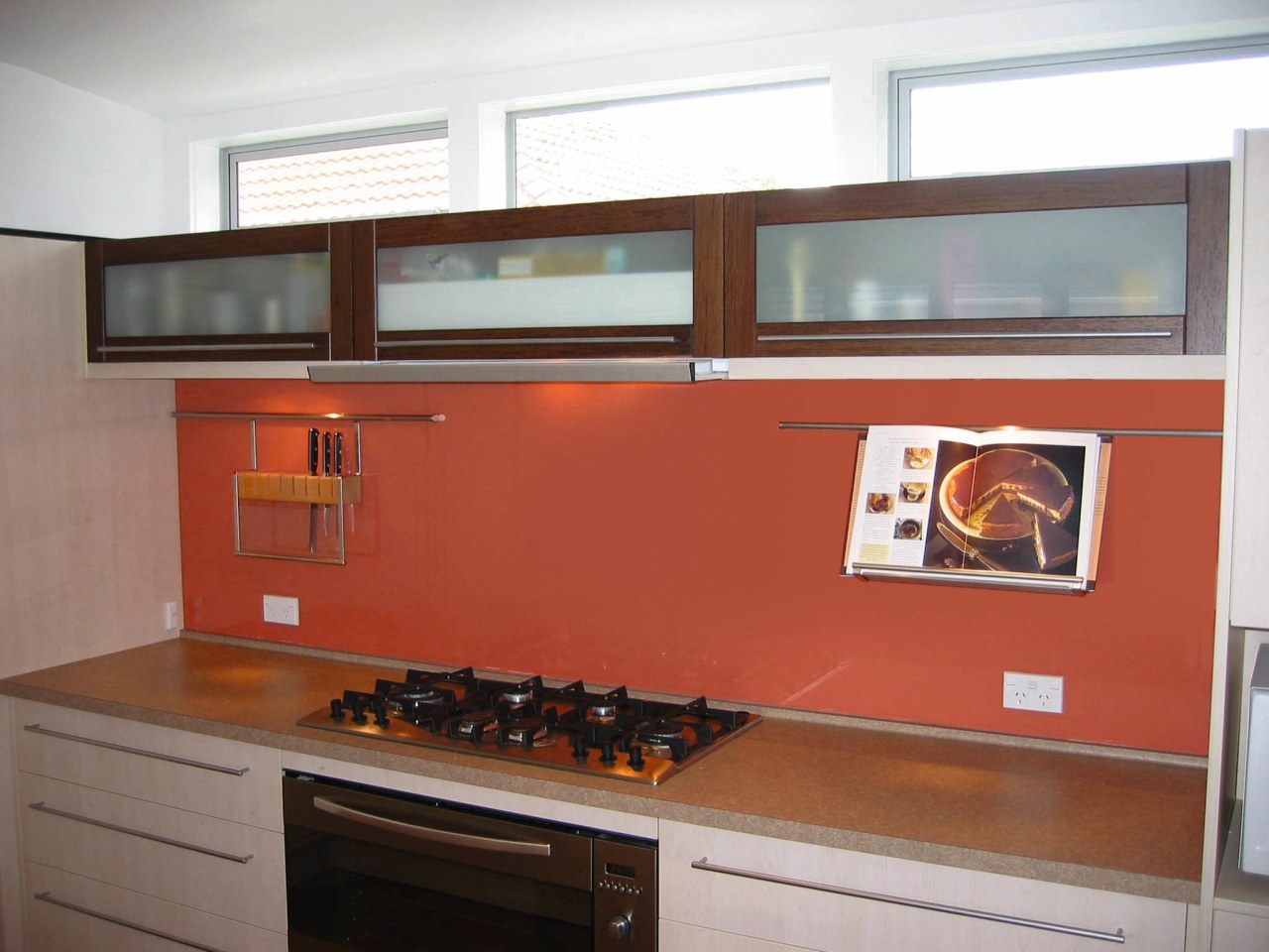 A view of a kitchen, wooden and white cabinetry, countertop, kitchen, room, white