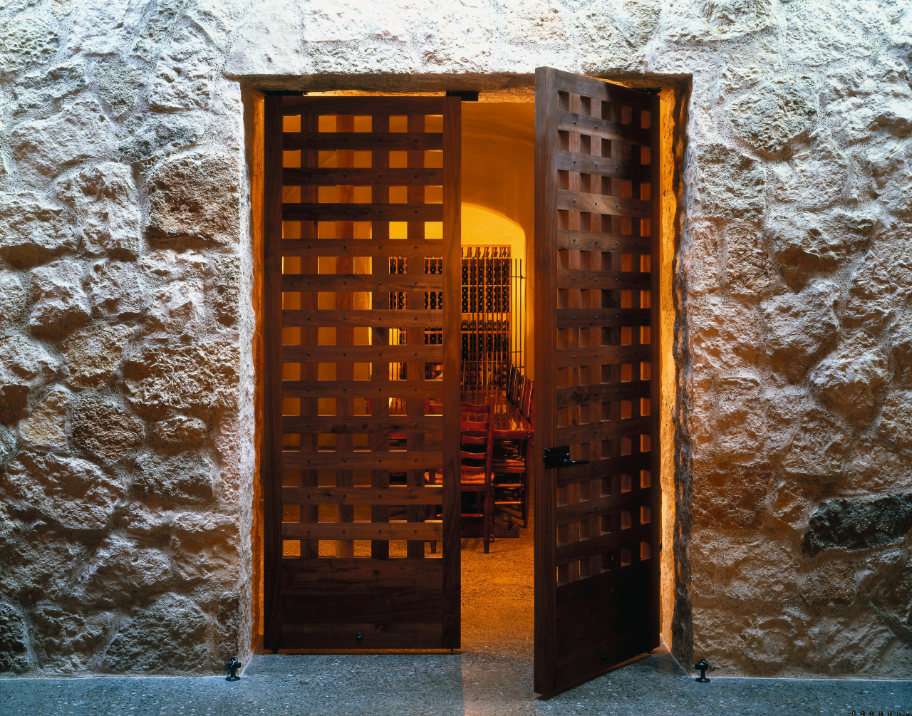 view of this door featuring large grilles that architecture, door, facade, wall, window, wood, brown