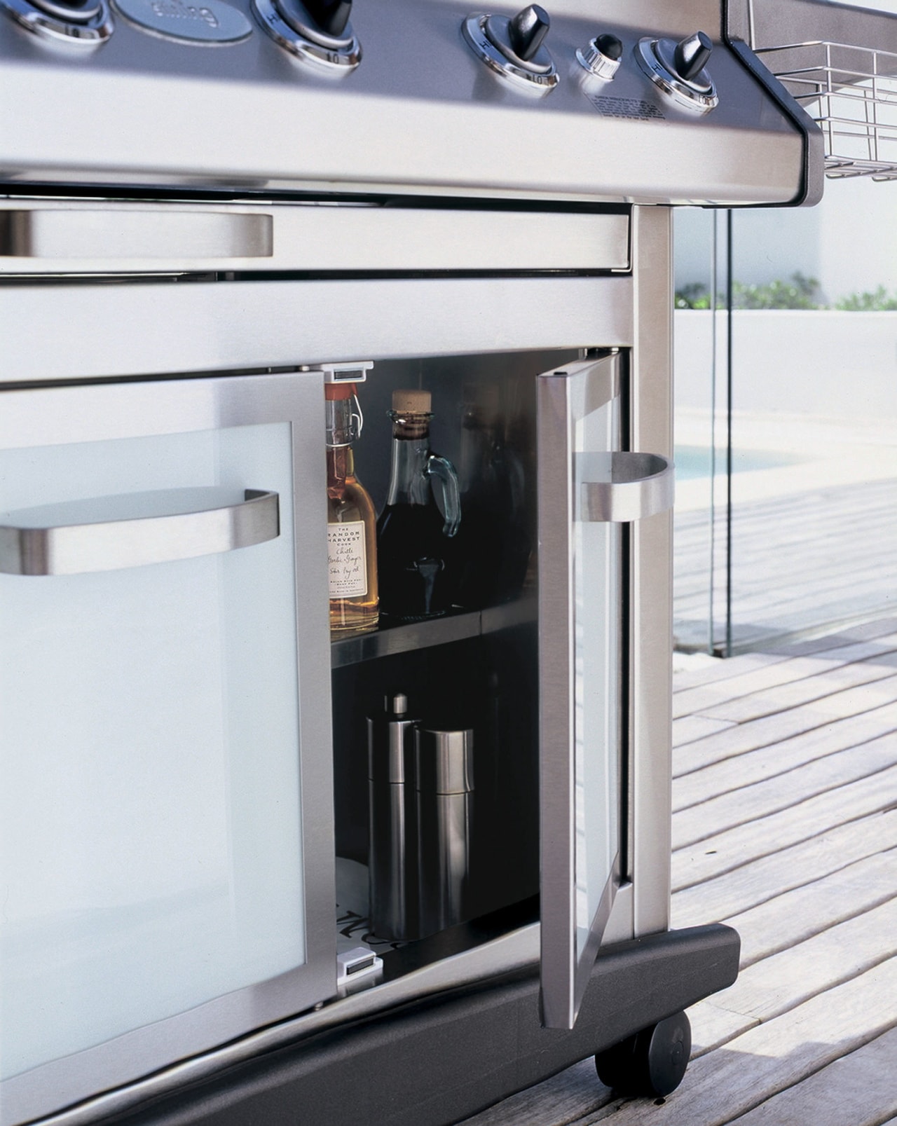 A close up view of a steel BBQ, furniture, product design, white