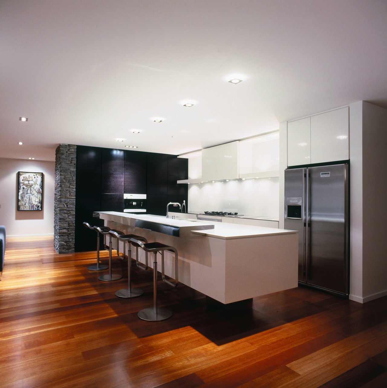A kitchen designed by the winner of the cabinetry, ceiling, countertop, floor, flooring, hardwood, interior design, kitchen, laminate flooring, living room, room, wood, wood flooring, gray