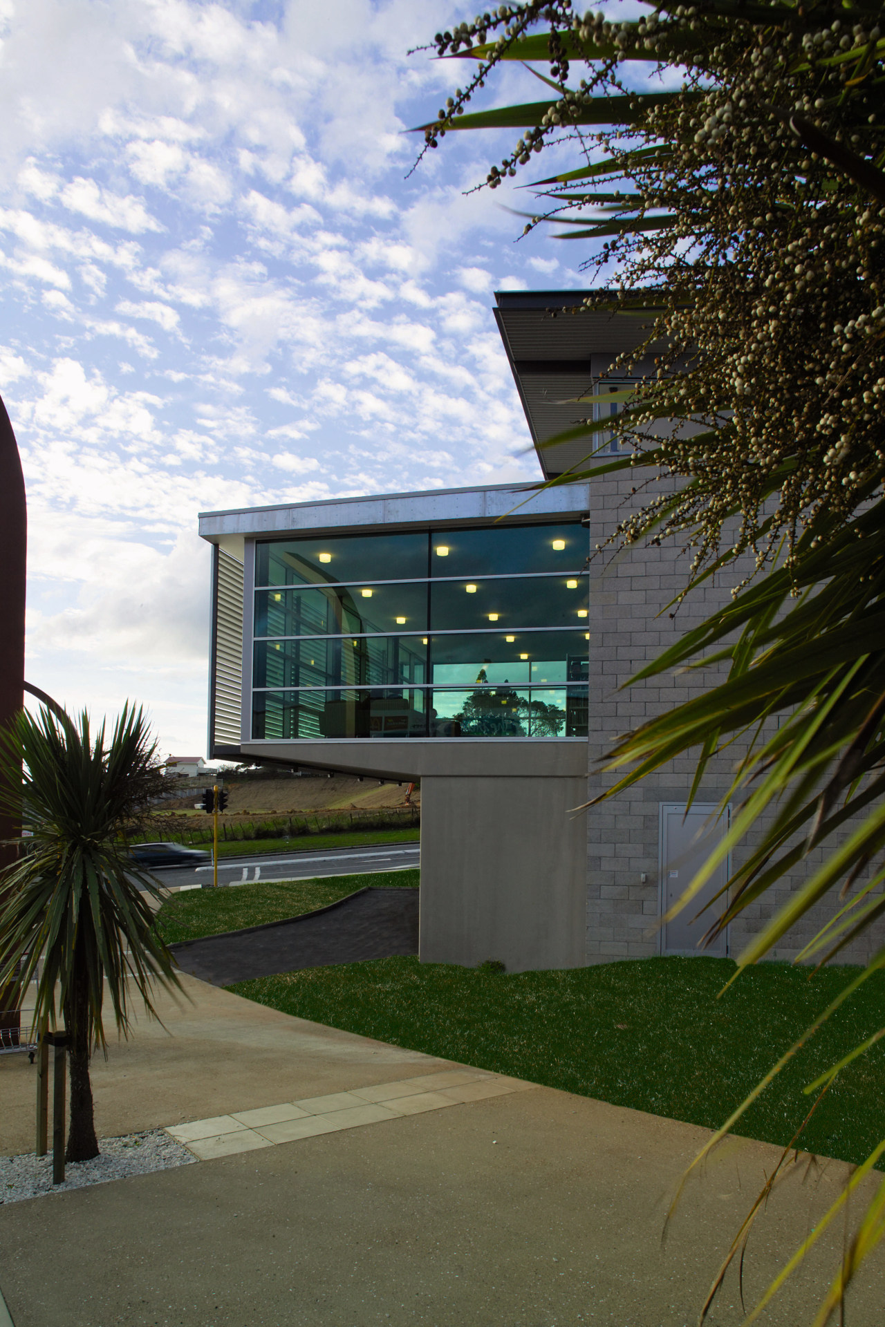 view of the library featuring double glazed windows architecture, arecales, building, facade, home, house, palm tree, real estate, reflection, sky, window, black, brown
