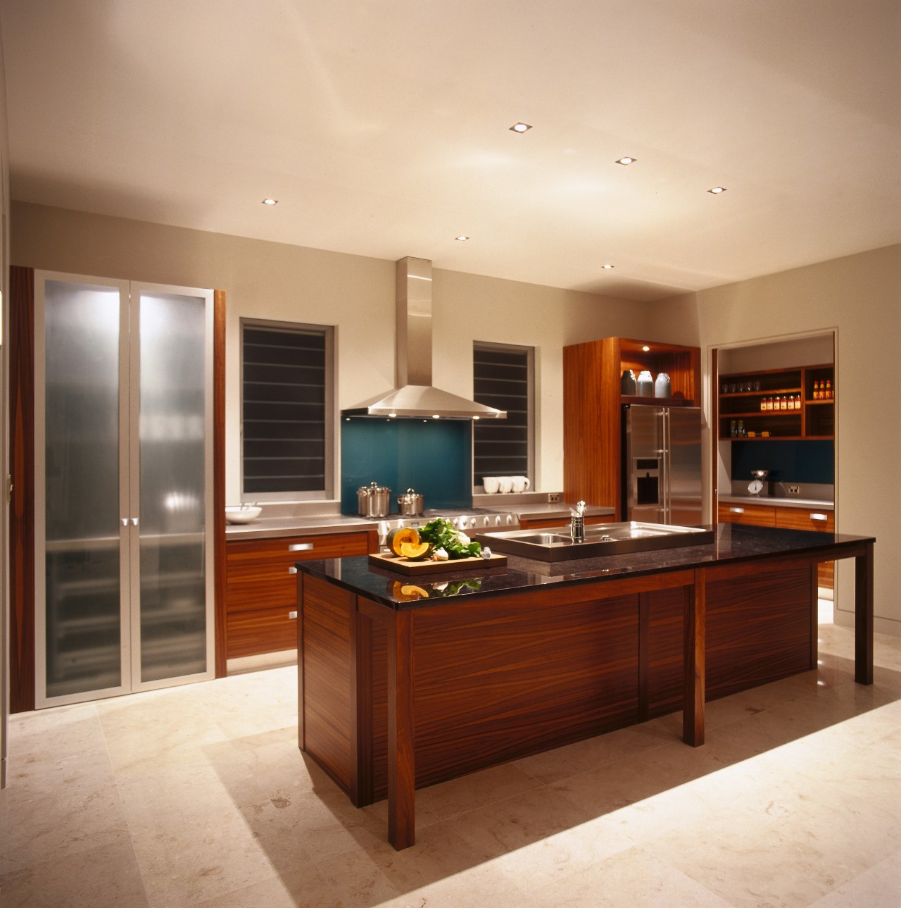 A view of a kitchen, wooden cabinetry, granite cabinetry, countertop, cuisine classique, floor, flooring, hardwood, interior design, kitchen, real estate, room, orange, brown