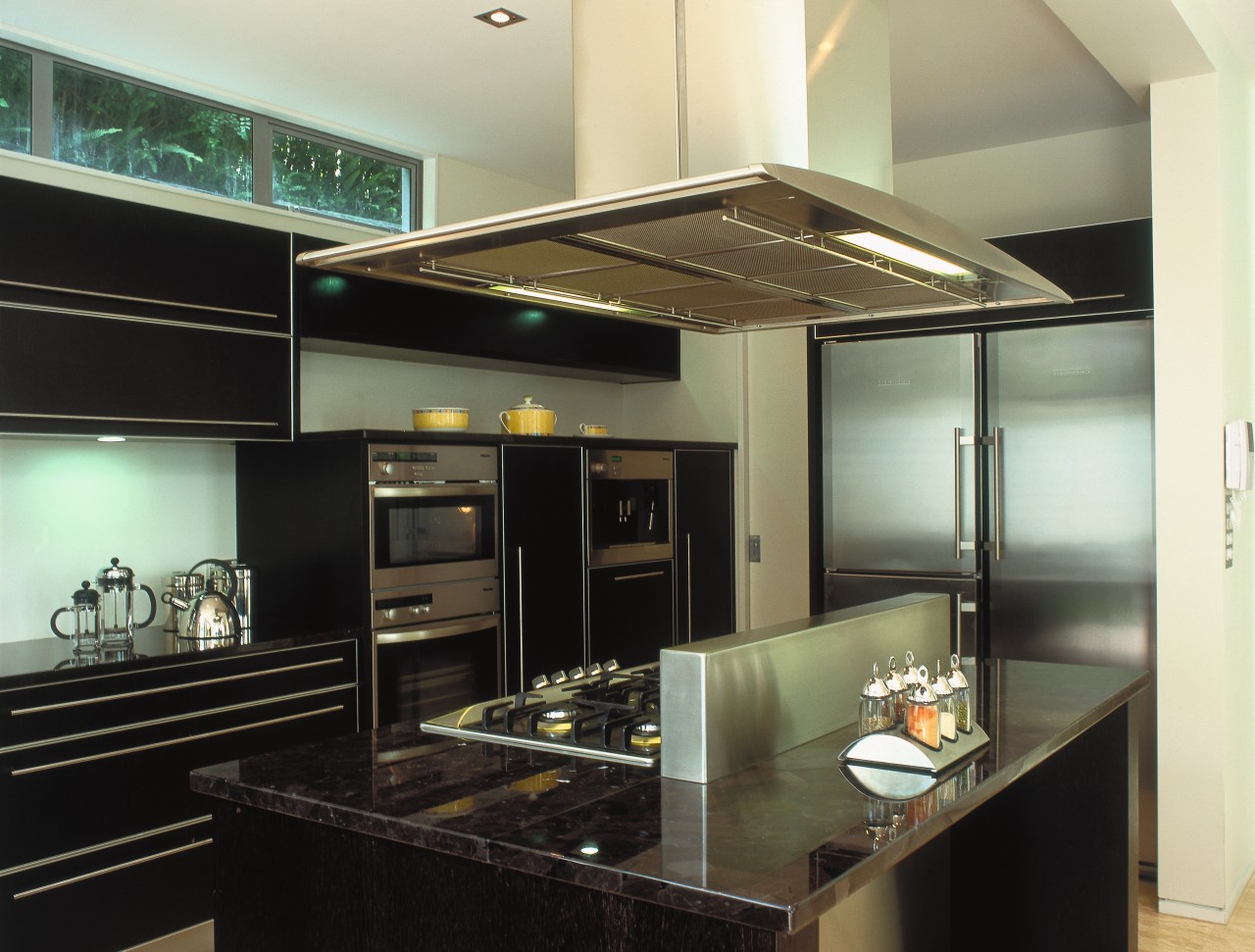 A view of a kitchen area, black granite ceiling, countertop, interior design, kitchen, under cabinet lighting, black