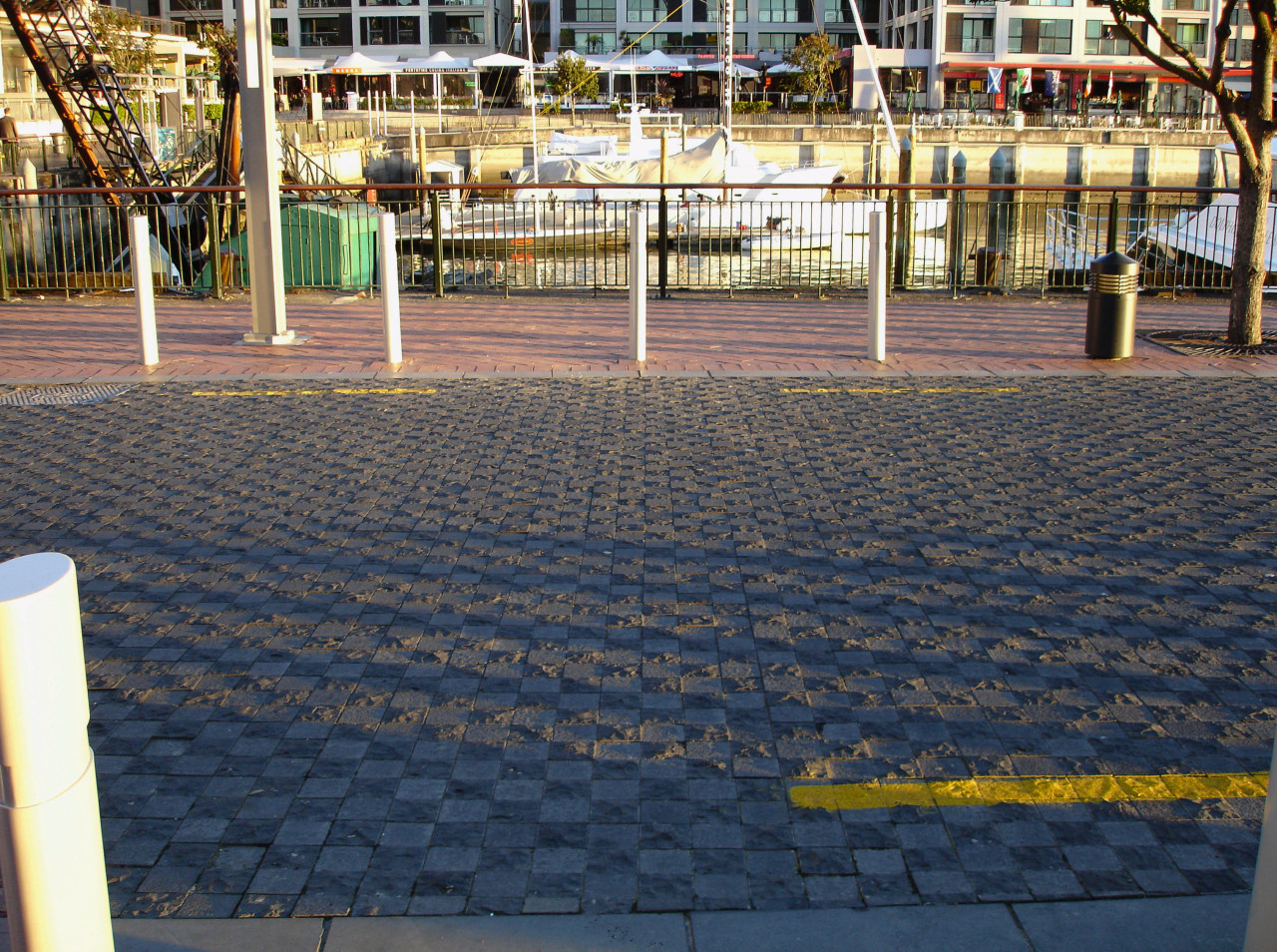 Patterned paving along waterfront. asphalt, floor, flooring, public space, road surface, sidewalk, structure, walkway