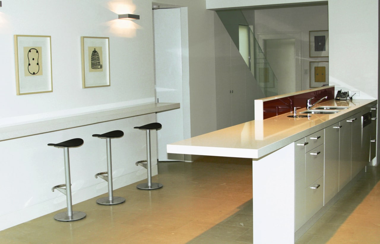 View of kitchen with light coloured stone benchtops, countertop, floor, flooring, furniture, interior design, kitchen, product design, property, room, sink, table, white, gray