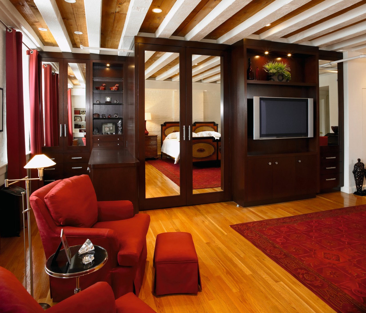 view of the custom wall unit that ceiling, flooring, hardwood, interior design, living room, room, suite, wood flooring, red, brown