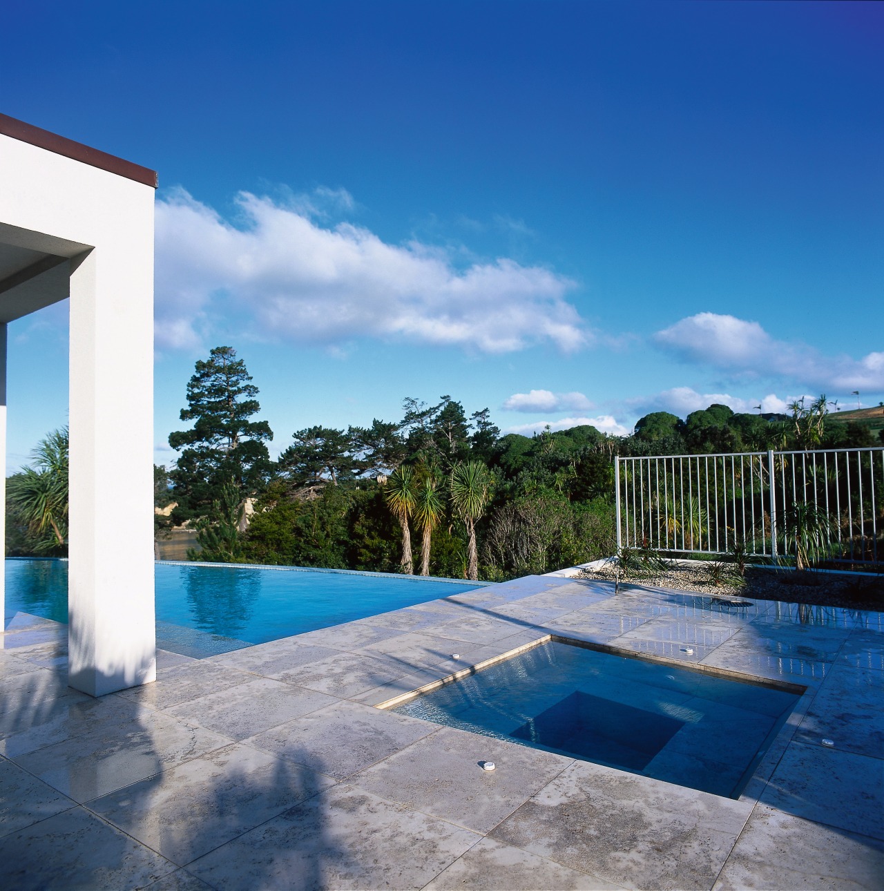 View of spa pool set into paving stones cloud, estate, home, house, leisure, property, real estate, reflection, resort, sky, swimming pool, vacation, villa, water, blue