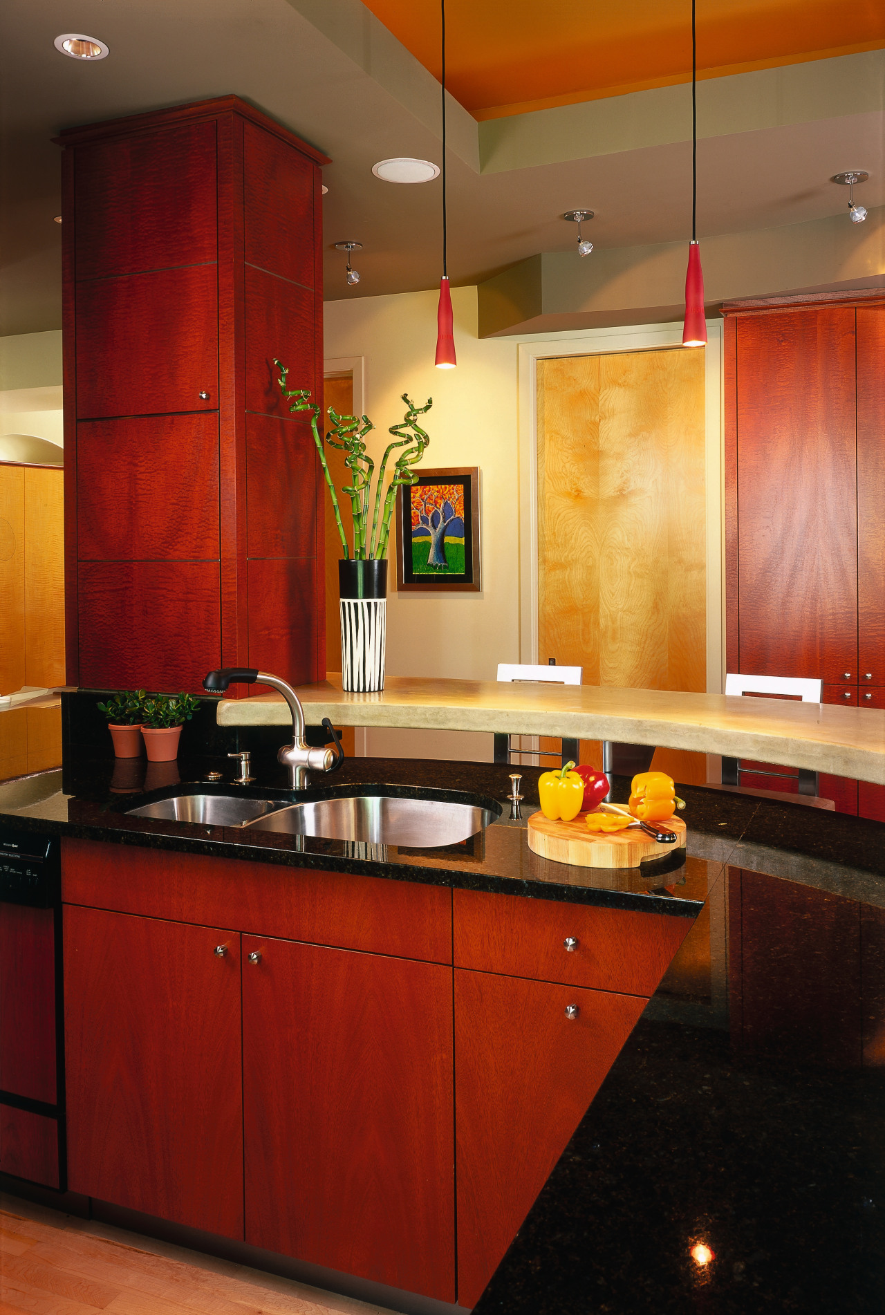 A view of a kitchen, wooden cabinetry and cabinetry, ceiling, countertop, interior design, kitchen, room, under cabinet lighting, wall, red