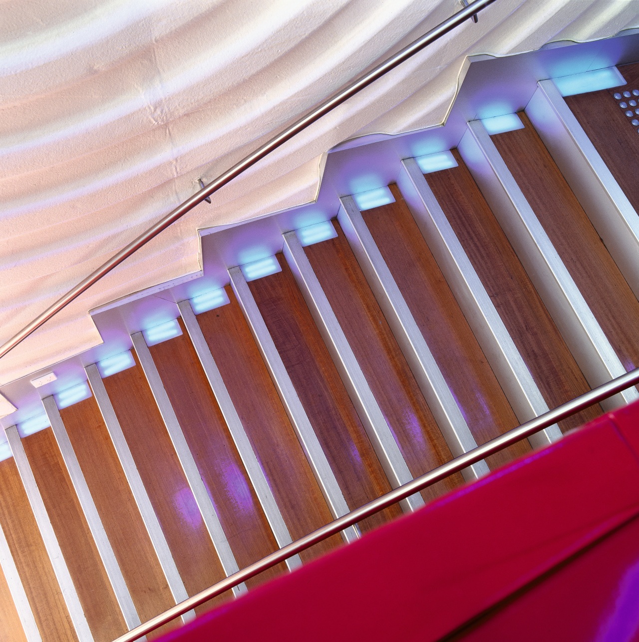 View of stairs with timber flooring. daylighting, light, line, material, pink, product, purple, red, wood, red, white