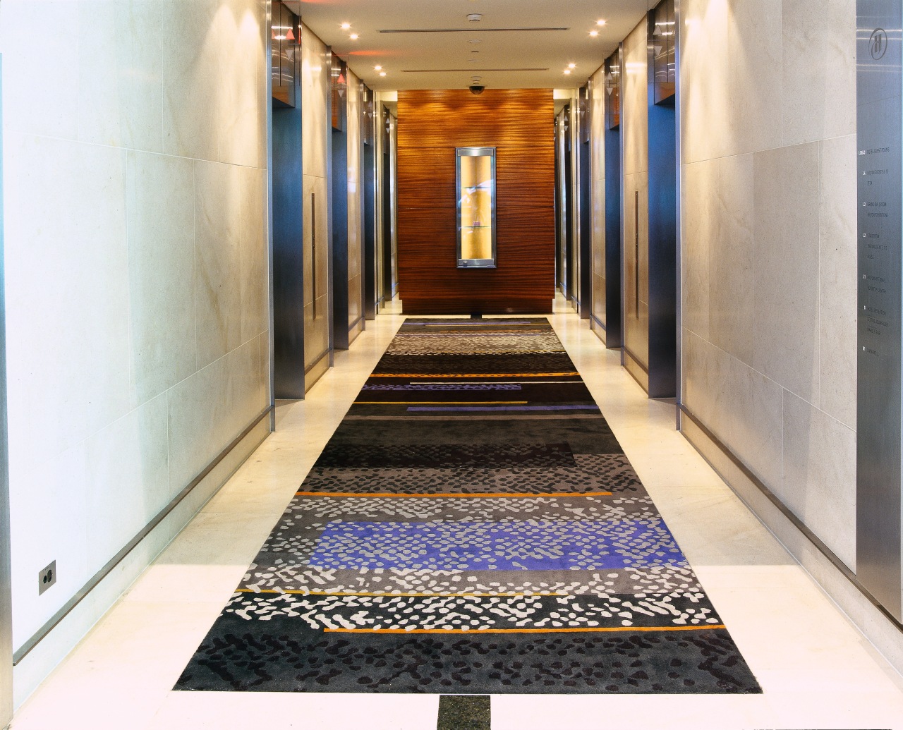 Long patterned rug in lift lobby. carpet, floor, flooring, interior design, tile, white