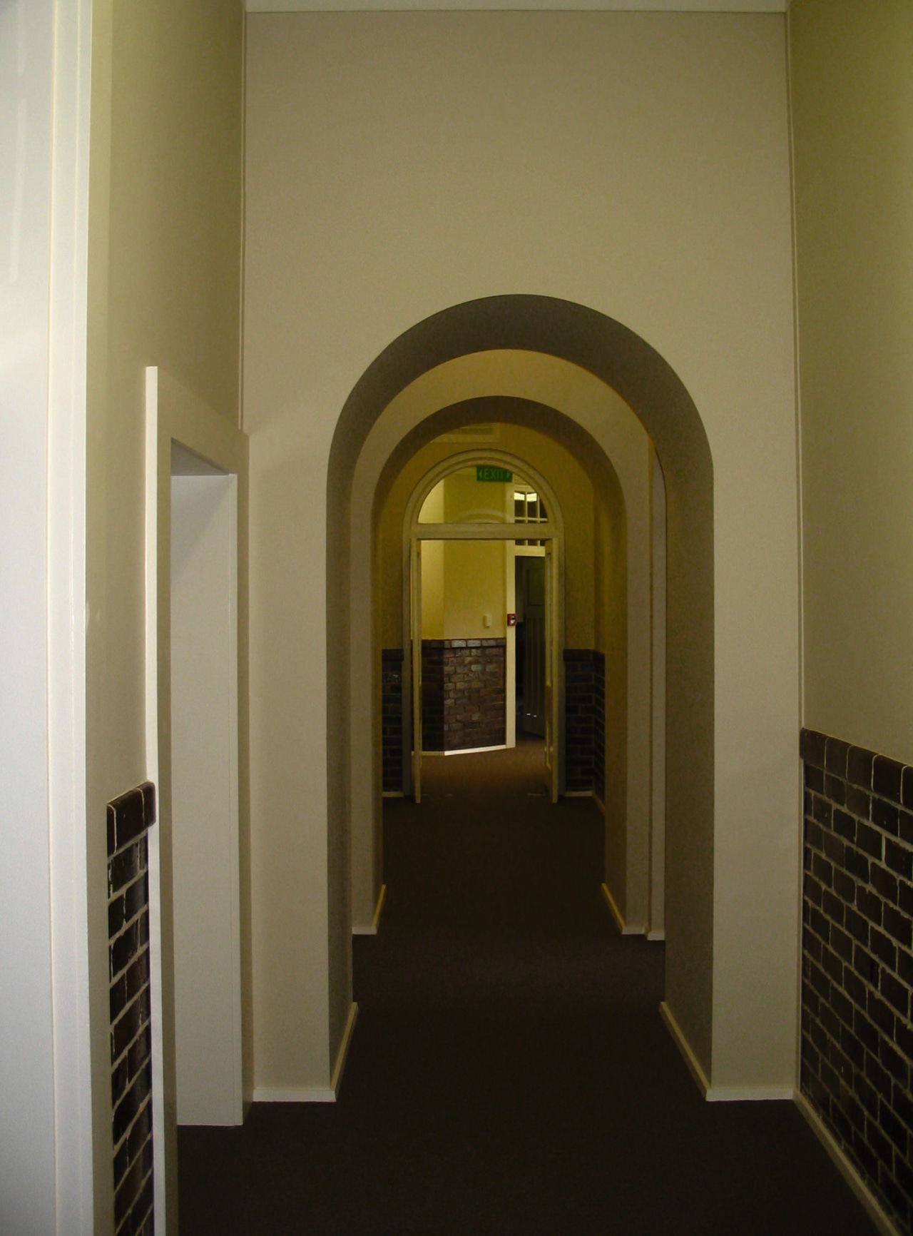 Hallway with arches, cream paint colour and brick arch, architecture, ceiling, daylighting, door, estate, hall, home, interior design, property, structure, wall, window, brown, black