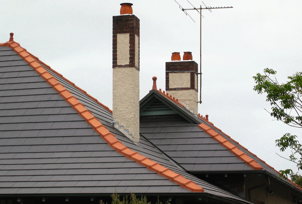 view of the ceramic tiles from nu-lok roofing building, chimney, facade, roof, sky, white, gray