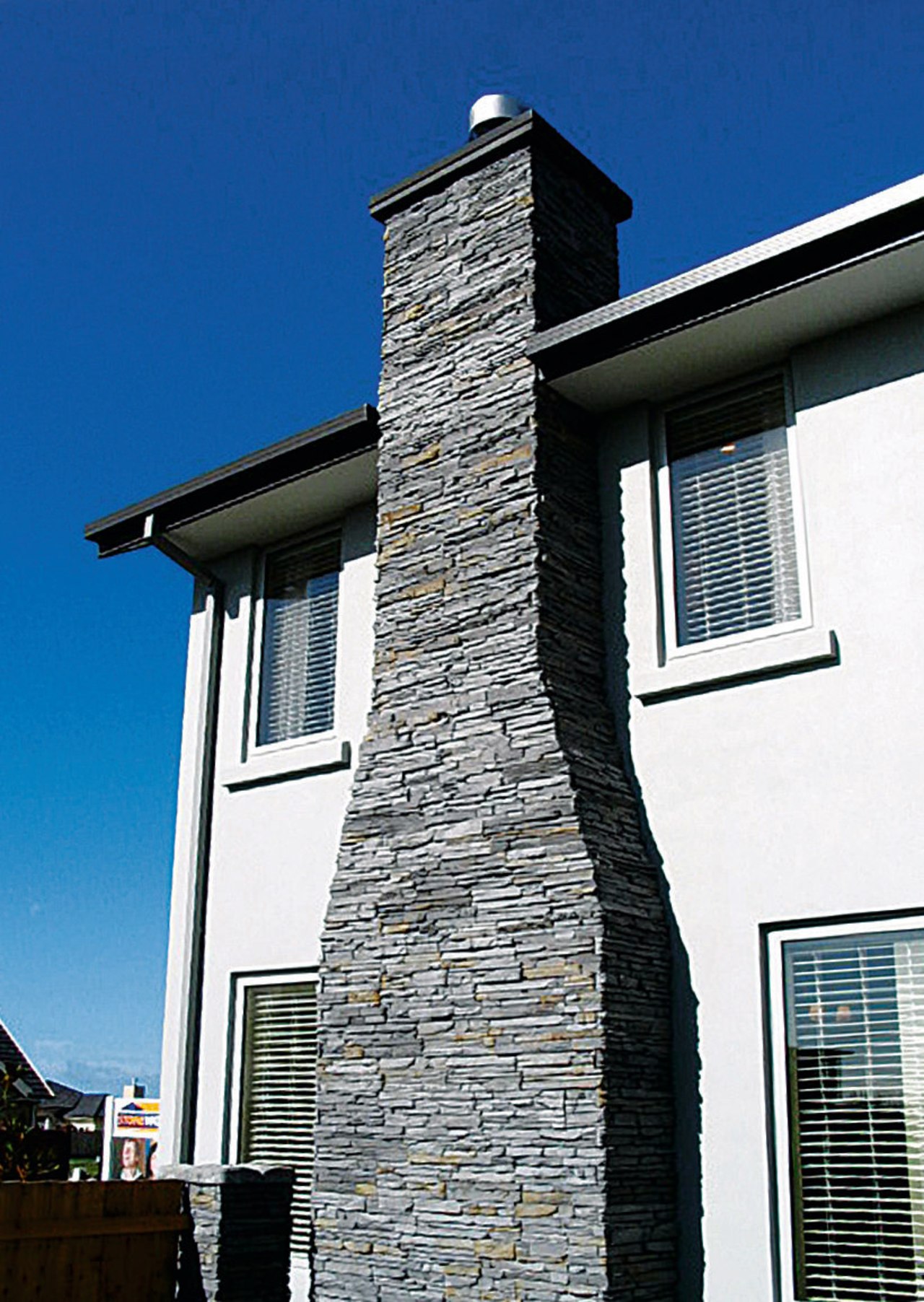 view of the stone veneers  that are architecture, building, chimney, facade, home, house, roof, sky, wall, window, blue, white