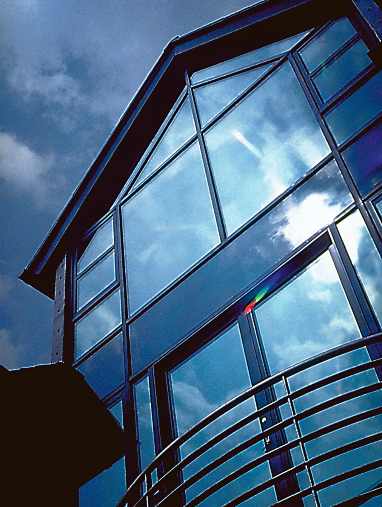 Exterior view of home with wall of tinted angle, architecture, blue, building, cloud, commercial building, corporate headquarters, daylighting, daytime, facade, glass, house, line, metropolitan area, reflection, sky, skyscraper, structure, symmetry, window, teal, blue