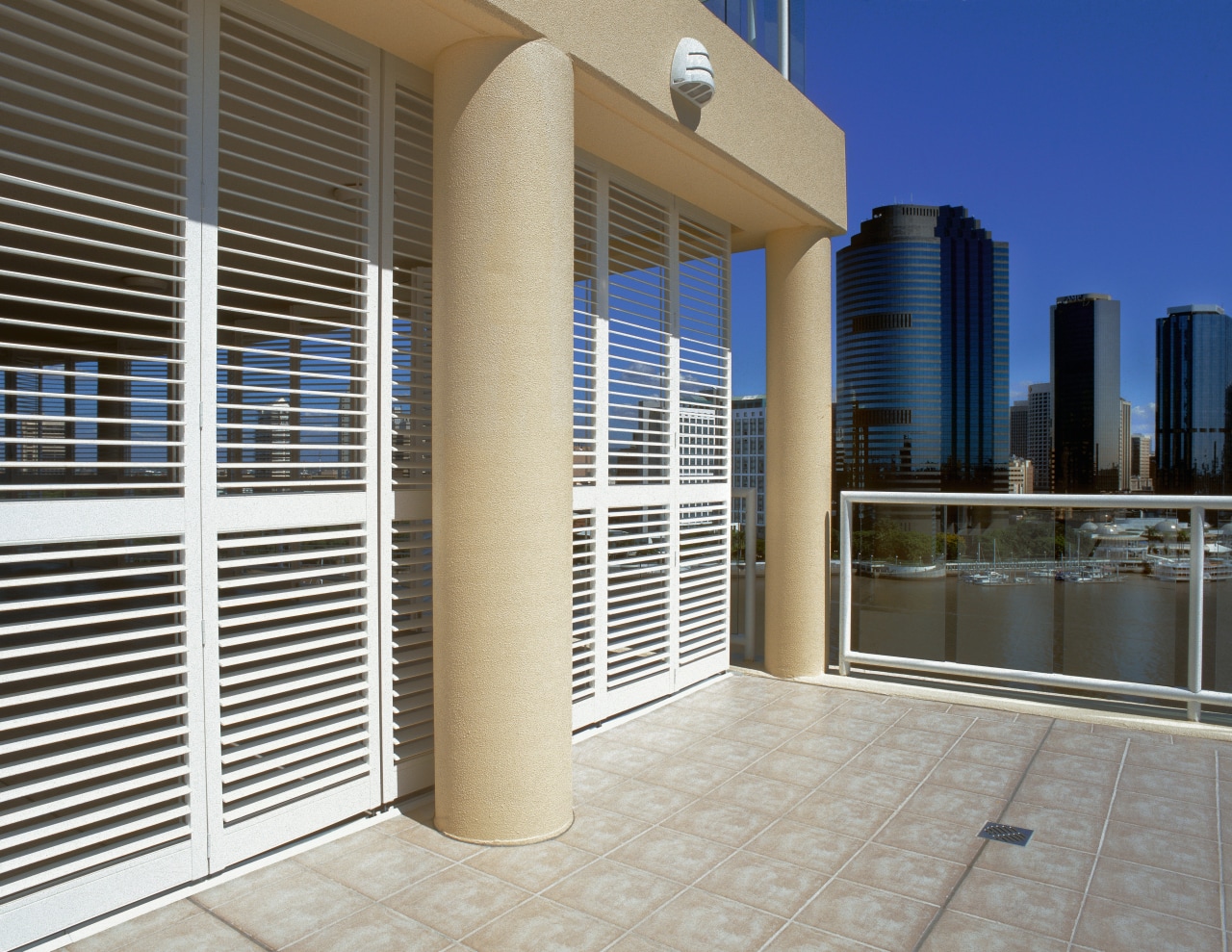 An exterior view of the shutters. apartment, building, condominium, daylighting, door, facade, property, real estate, window, window covering, gray