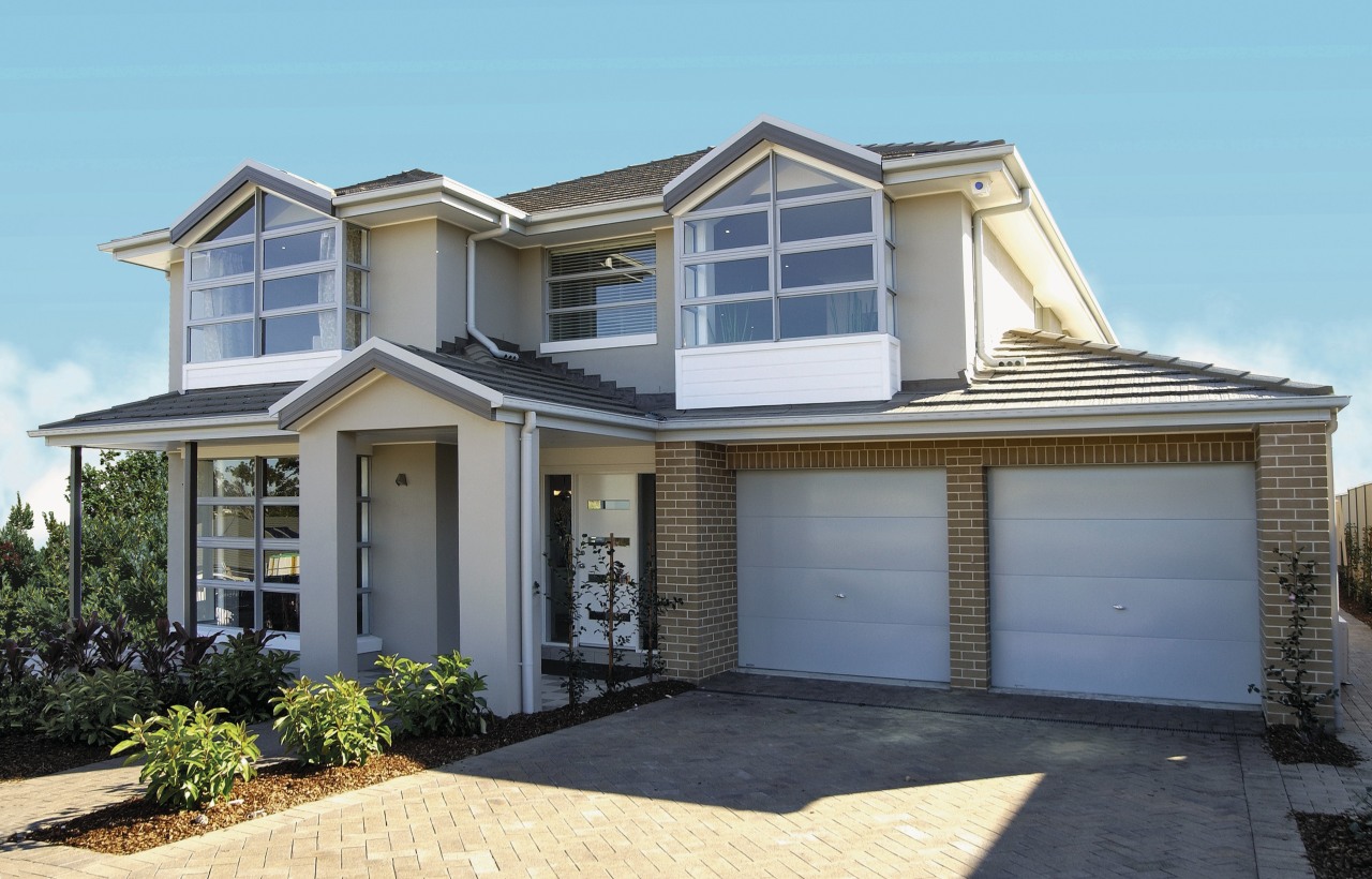 An exterior view of the house, brick driveway, building, elevation, estate, facade, home, house, property, real estate, residential area, siding, window, gray