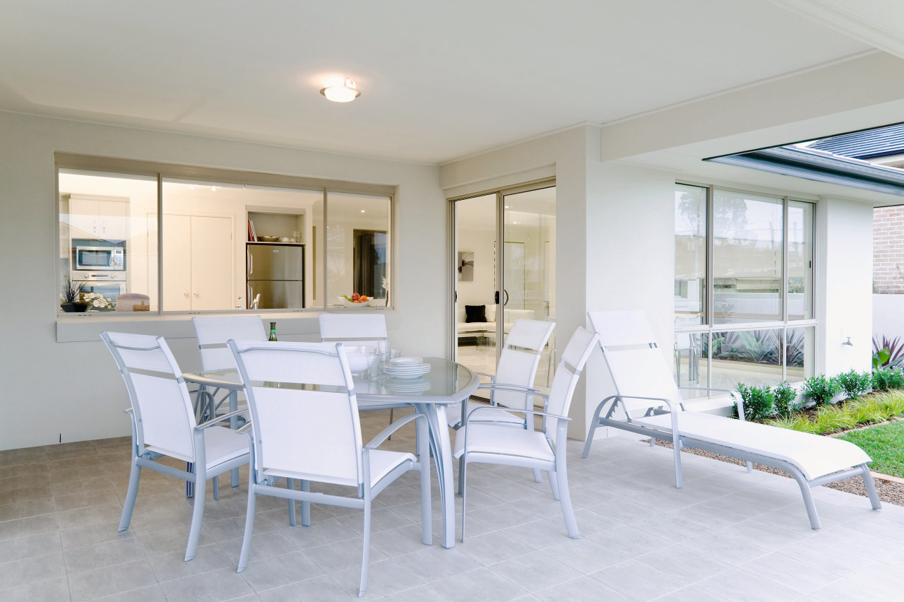 view of the alfresoc dining area that opens apartment, dining room, home, interior design, property, real estate, table, window, gray, white