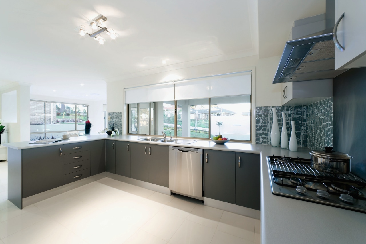 view of the bright open kitchen featuring modern countertop, cuisine classique, daylighting, interior design, kitchen, property, real estate, room, window, white