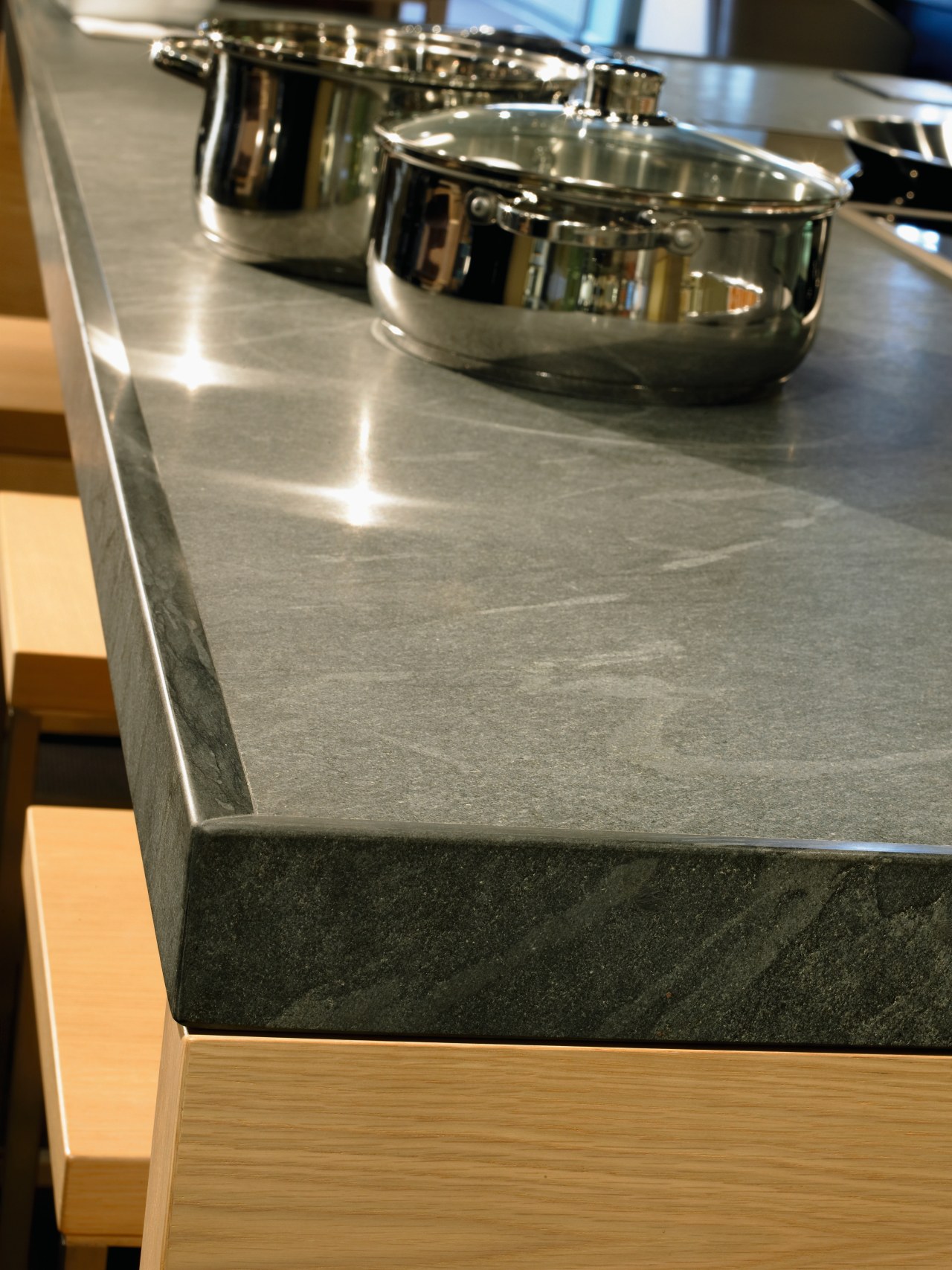 view of this granite countertop by countertop, floor, flooring, furniture, material, table, brown