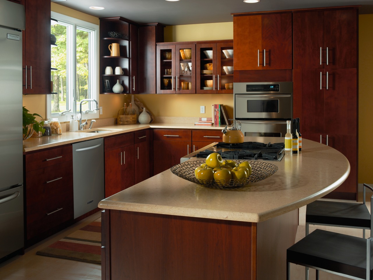 view of this kitchen featuring the  yellow cabinetry, countertop, cuisine classique, hardwood, interior design, kitchen, room, red