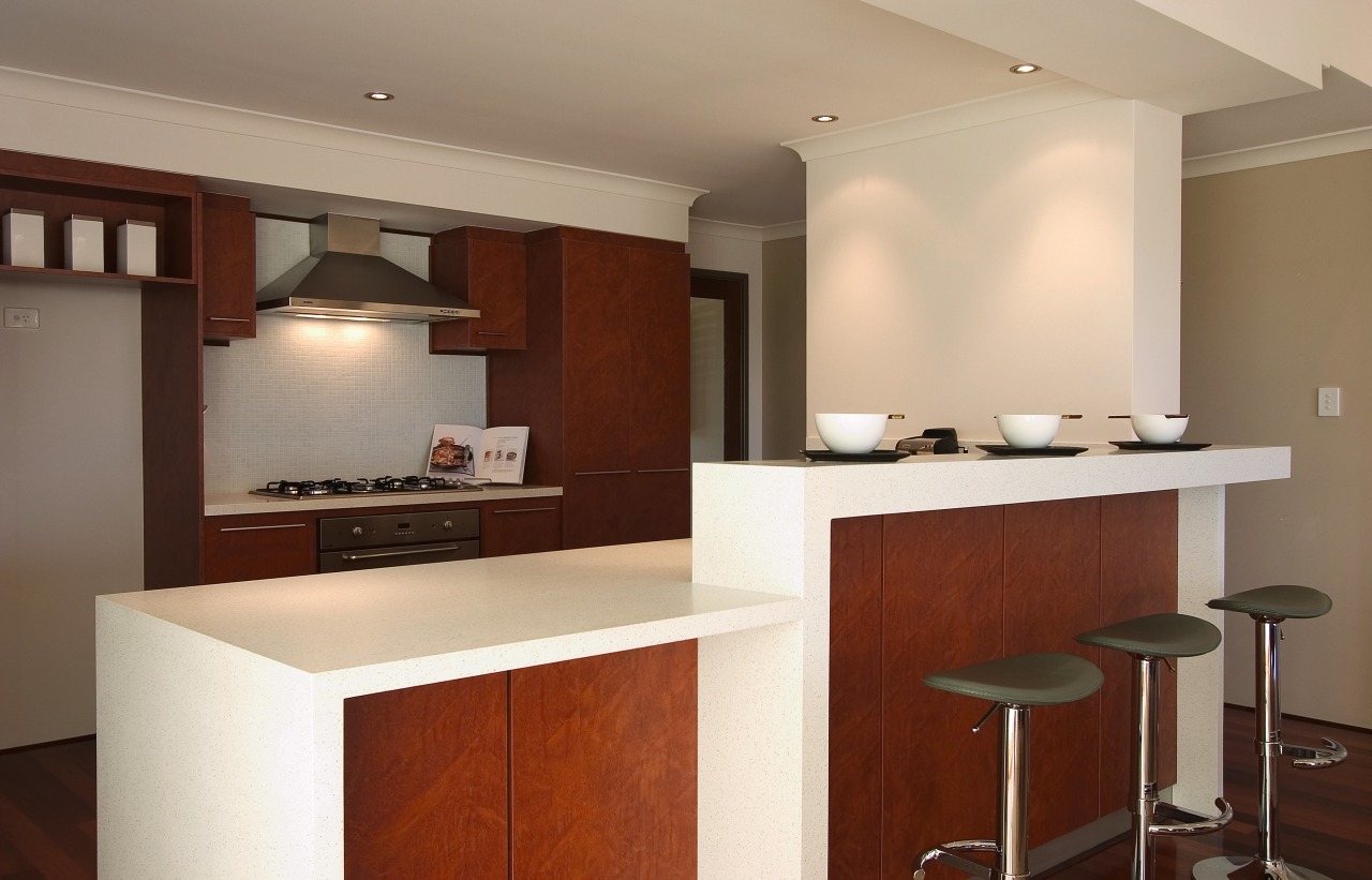 view of this clean contemporary kitchen that features cabinetry, countertop, cuisine classique, floor, flooring, interior design, kitchen, property, real estate, room, gray, brown