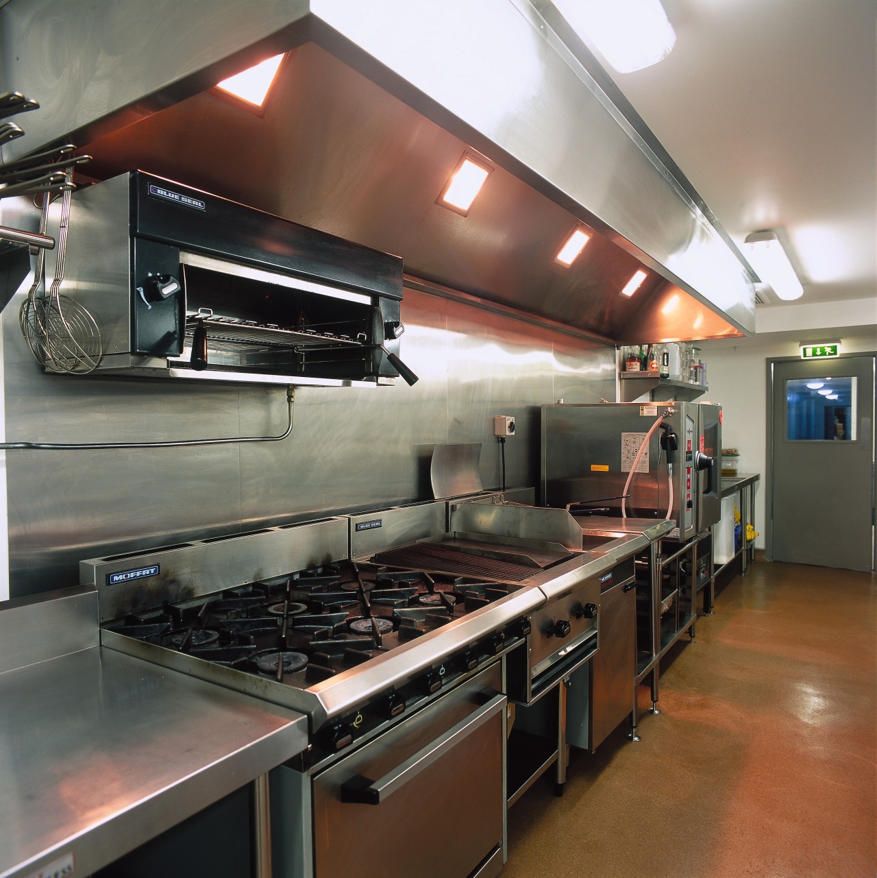 A view of al of the kitchen equipment. countertop, kitchen, gray, brown