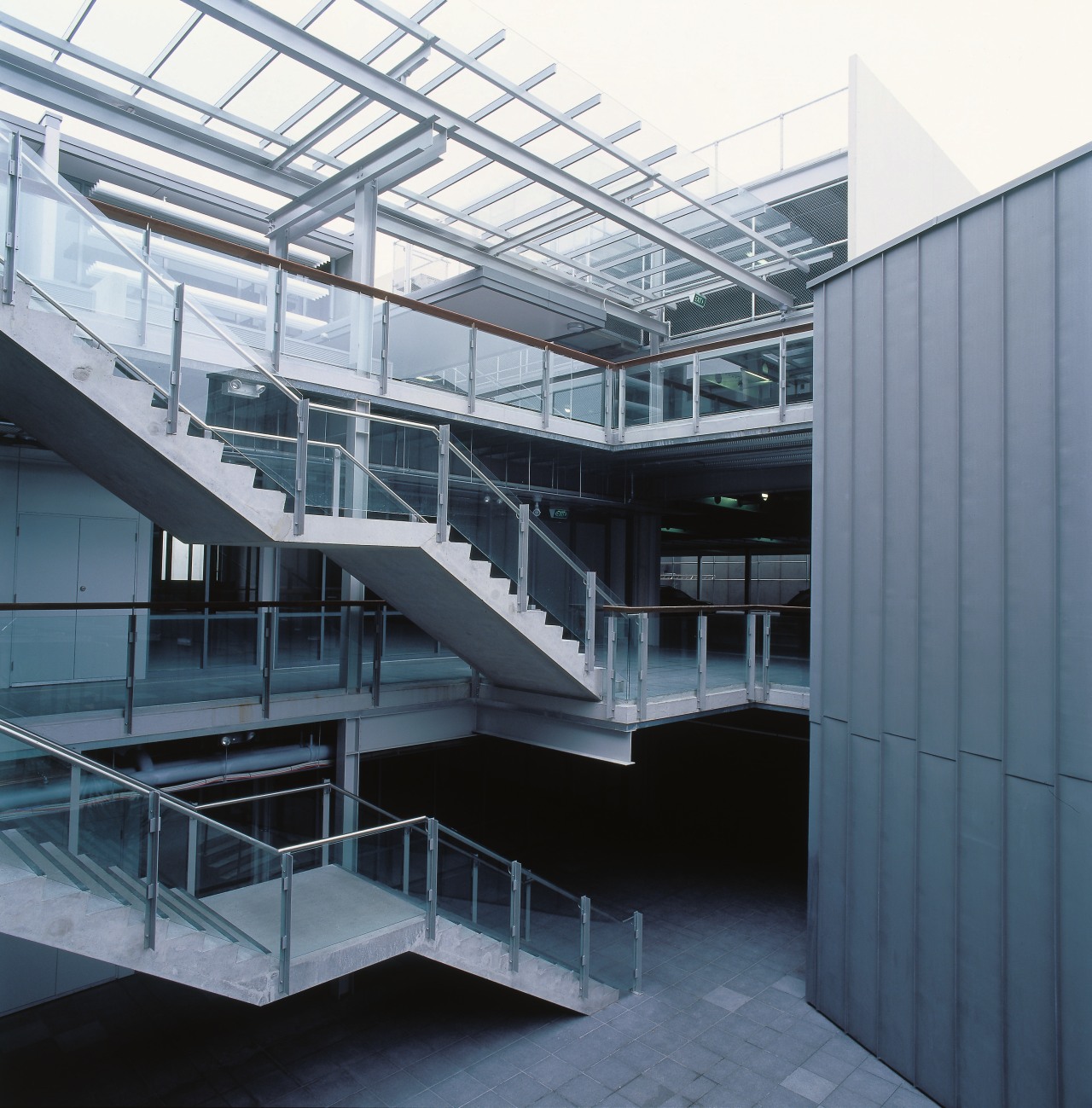 A view of the construction work. architecture, building, commercial building, corporate headquarters, daylighting, facade, glass, headquarters, mixed use, stairs, structure, gray