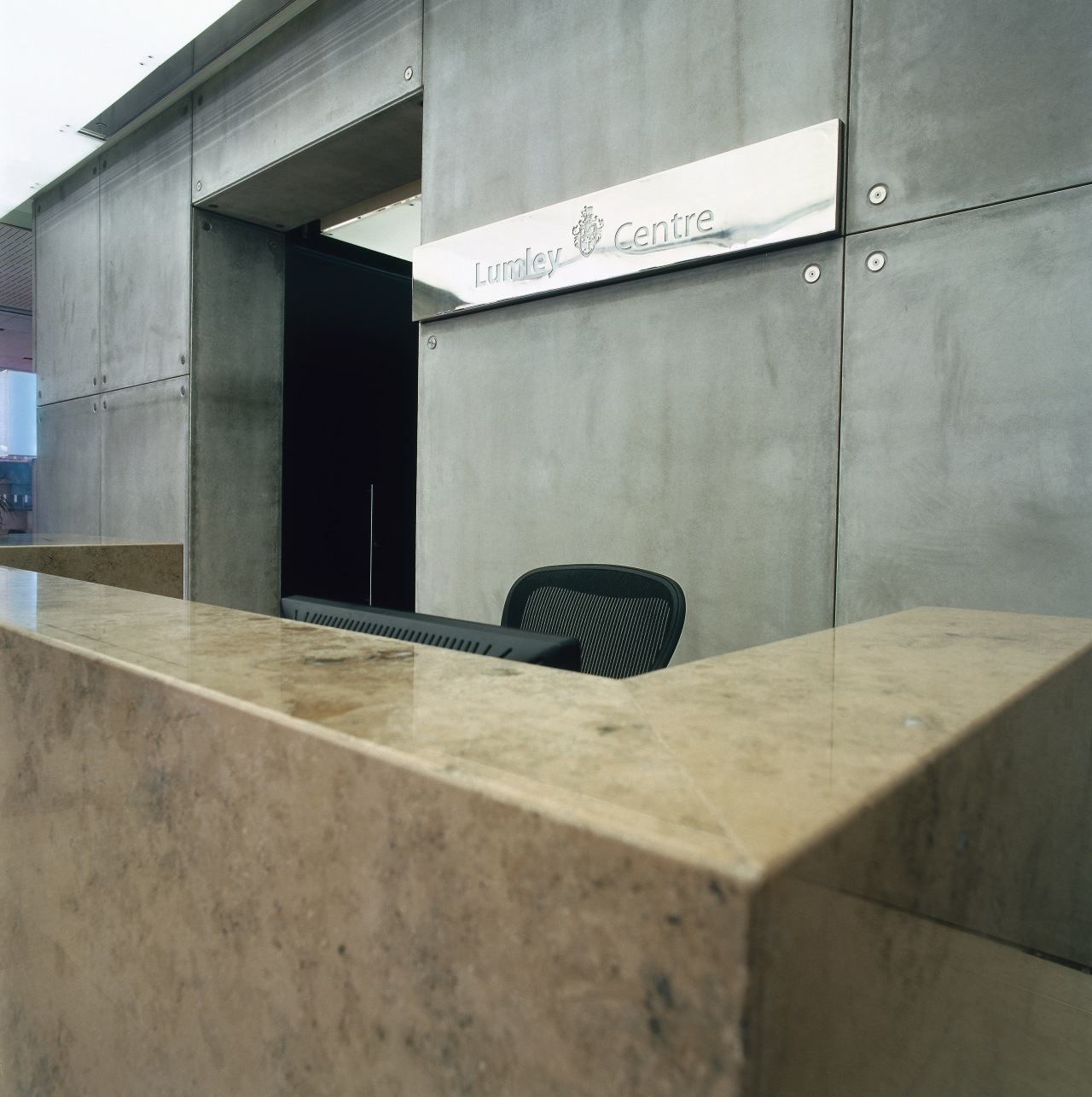 A view of the signage placed about the architecture, concrete, floor, gray