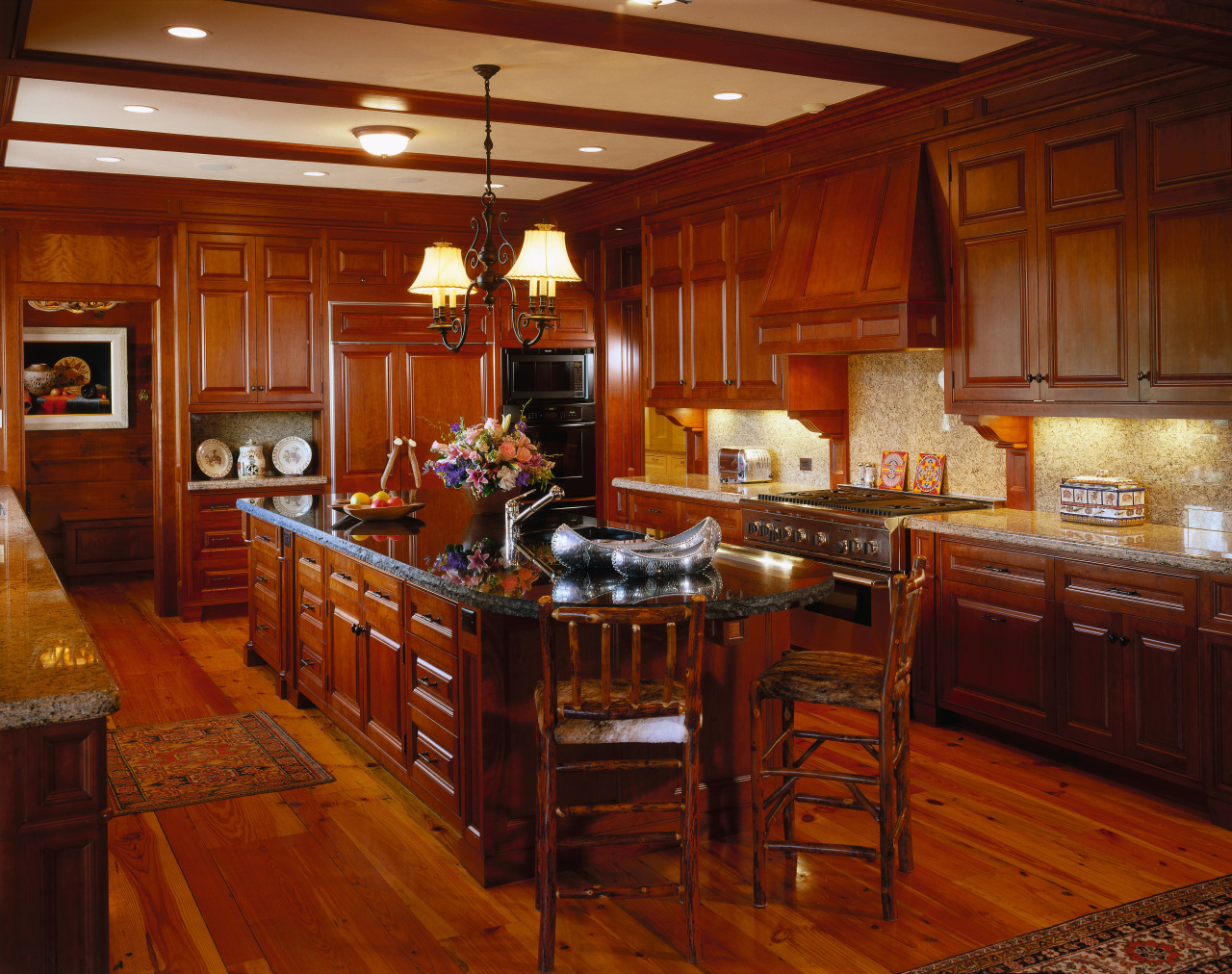 Kitchen with timber flooring, cabinetry and chairs, and cabinetry, countertop, cuisine classique, flooring, hardwood, home, interior design, kitchen, room, wood, wood flooring, brown, red