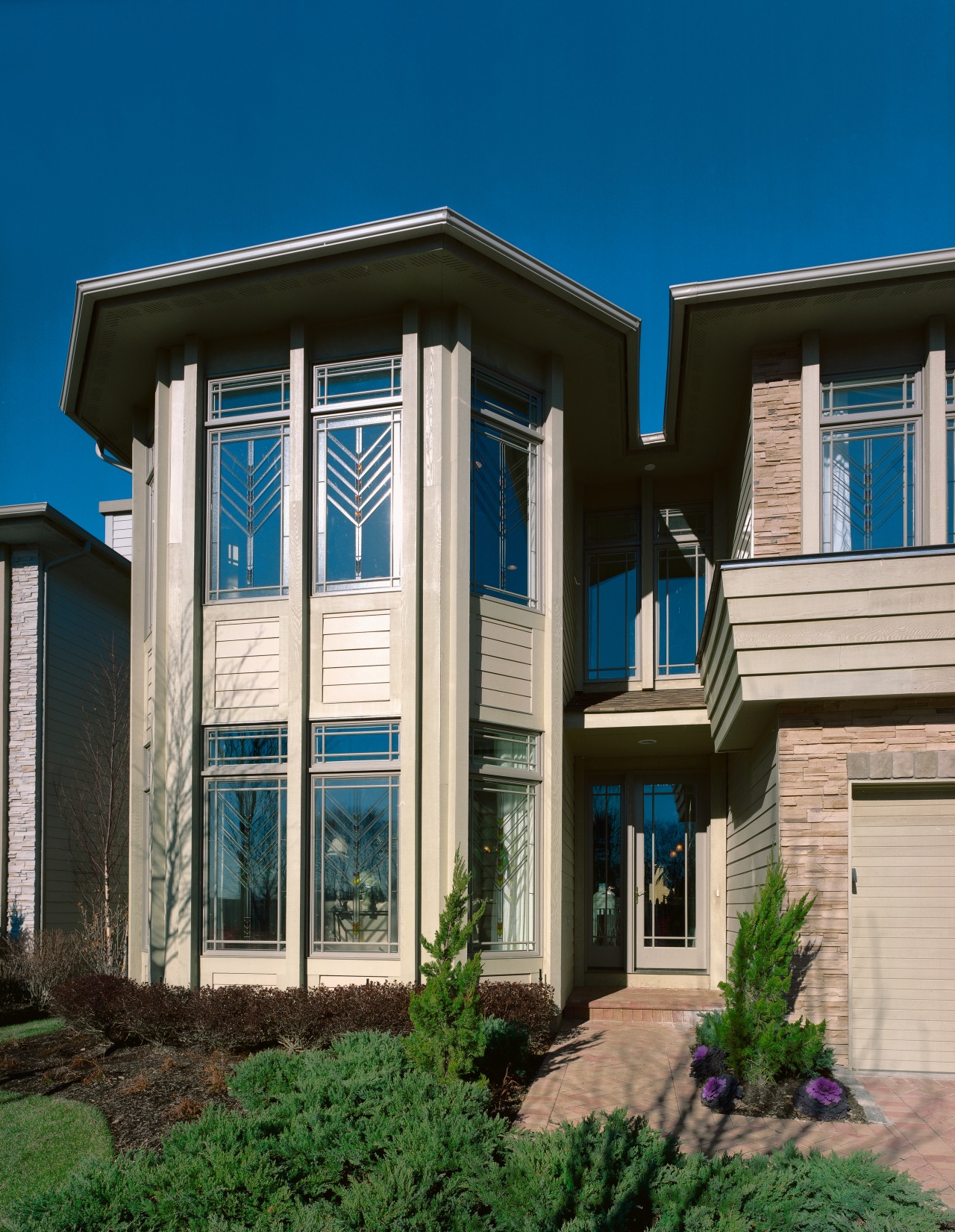 Exterior entranceway of home featuring coloured glass chevron architecture, building, commercial building, elevation, facade, home, house, property, real estate, residential area, siding, sky, window, blue, gray